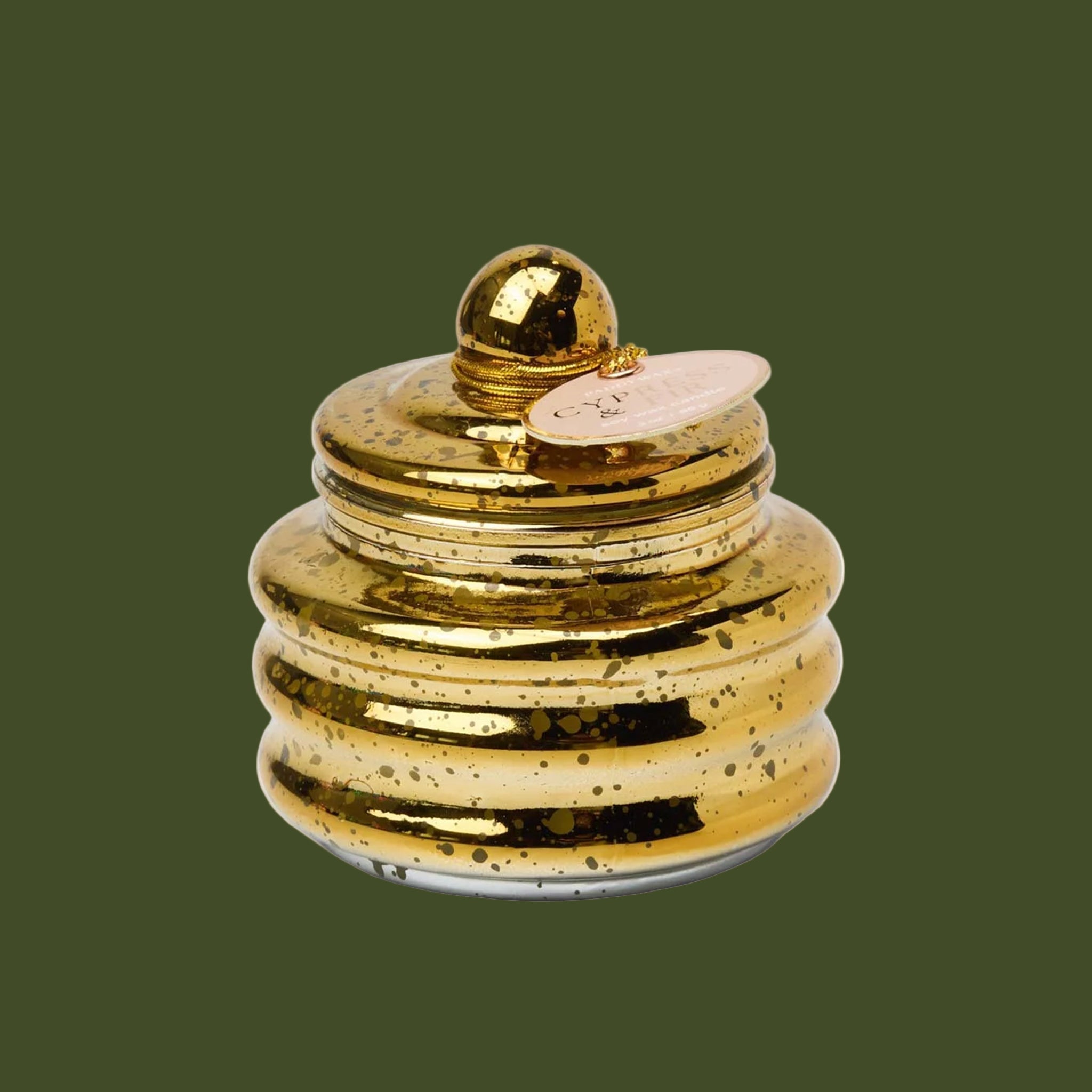 A gold lidded candle. 
