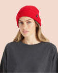 A red ribbed beanie. 
