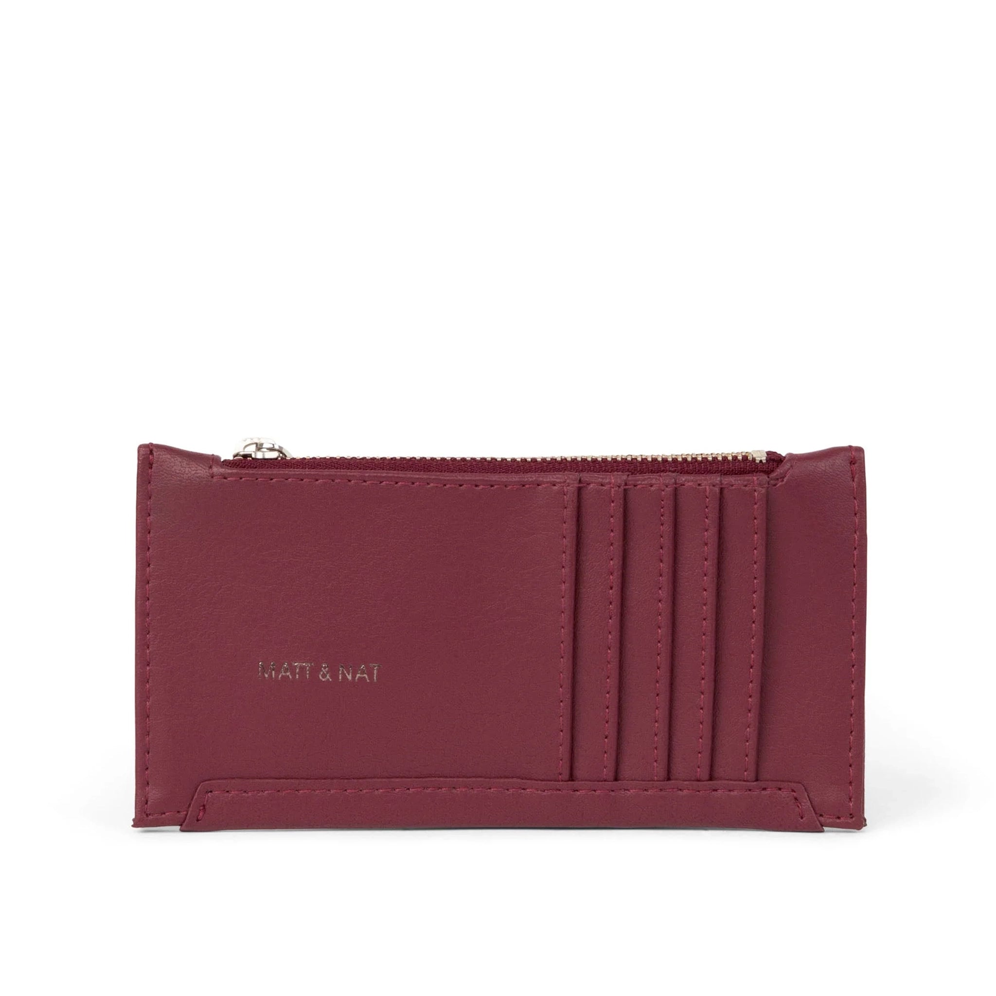 On a white background is a dark cherry red with card slots on the outside and a zipper pocket. 