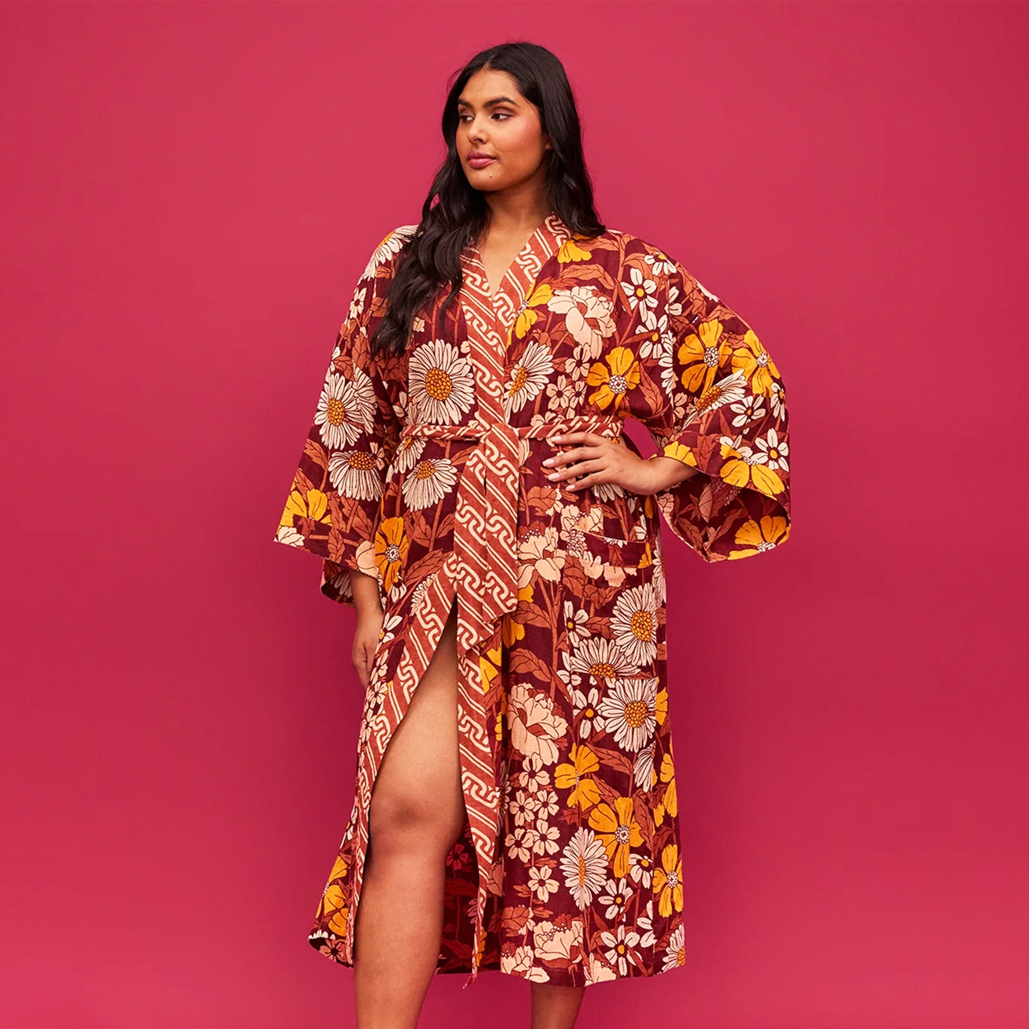 A rust, yellow and cream 70&#39;s inspired floral print linen robe. 