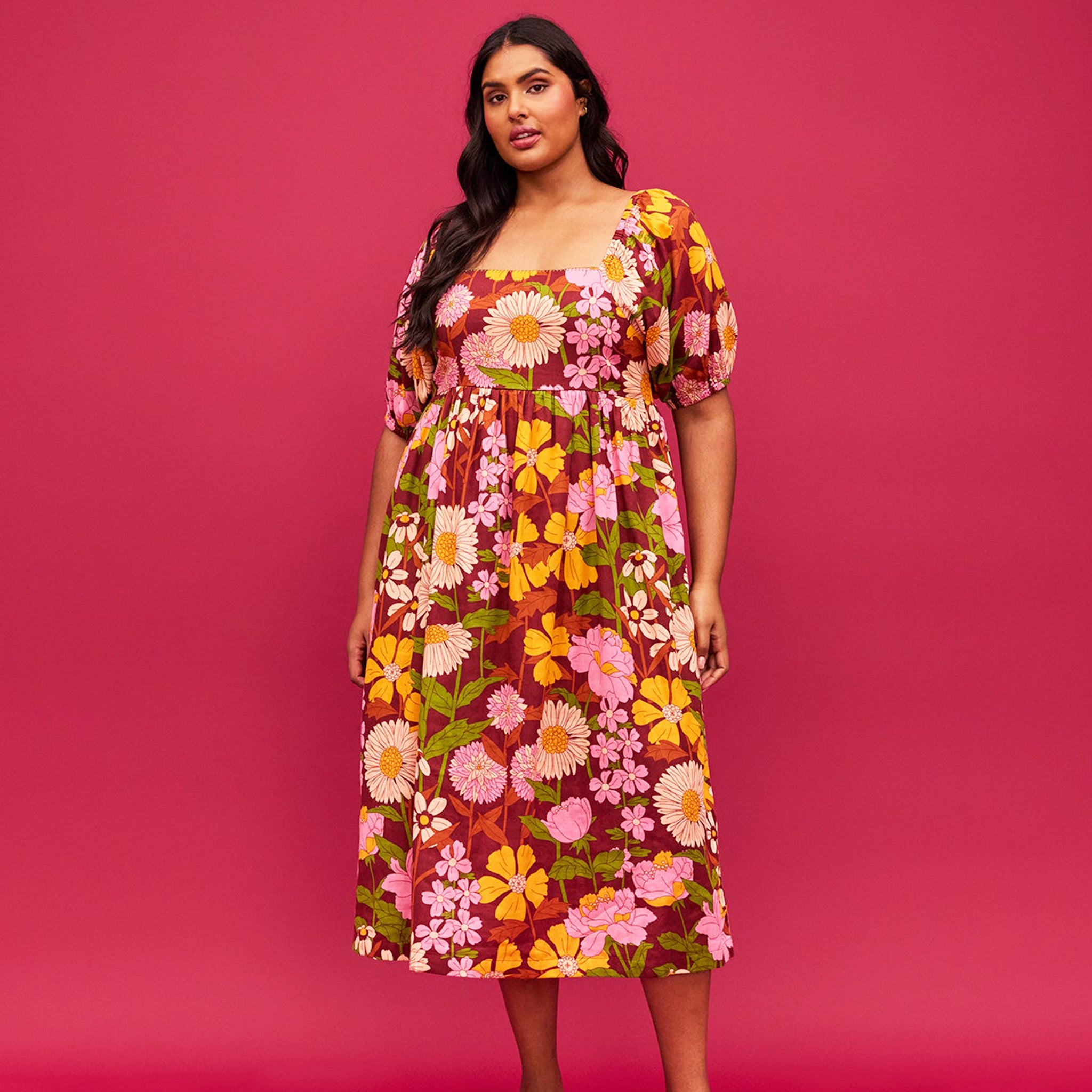 A mutli colored floral print maxi dress with puff sleeves and pockets. A mutli colored floral print maxi dress with puff sleeves and pockets.