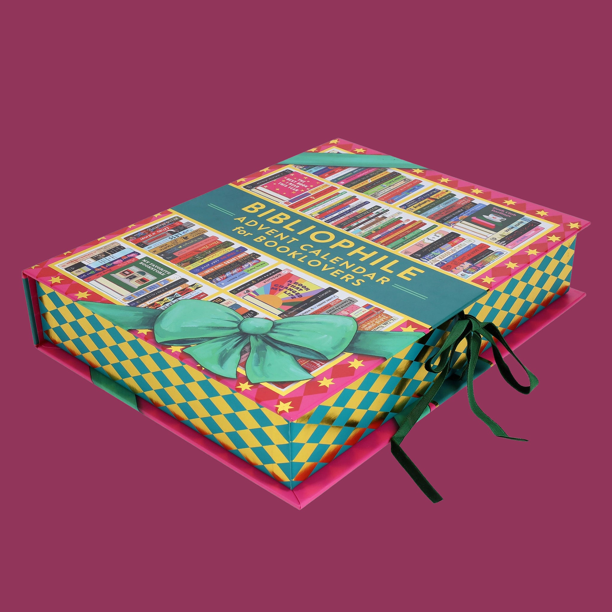 A box that reads "bibliophile advent calendar for booklovers" on a pink background with a green bow.