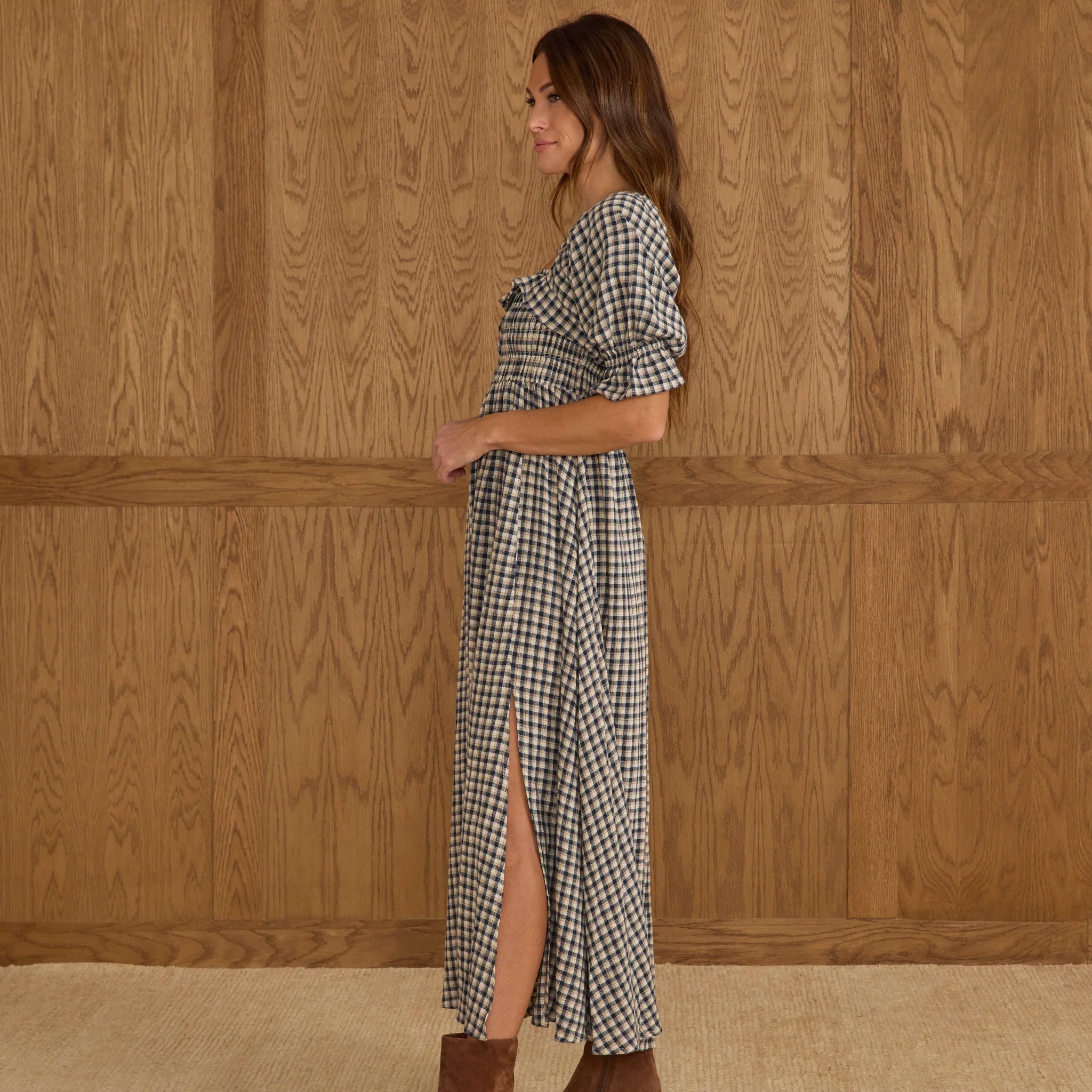 A navy and ivory checker maxi dress with a slit and puff short sleeves. 