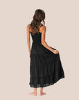 A black tiered maxi dress with spaghetti straps. 