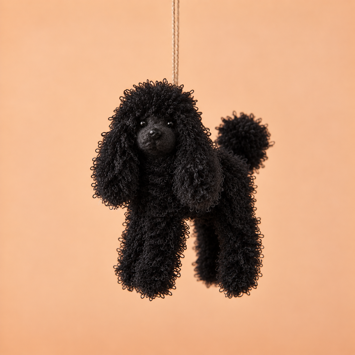 a black poodle ornament. 