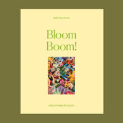 A yellow boxed puzzle with a floral print 1000 piece puzzle inside. 