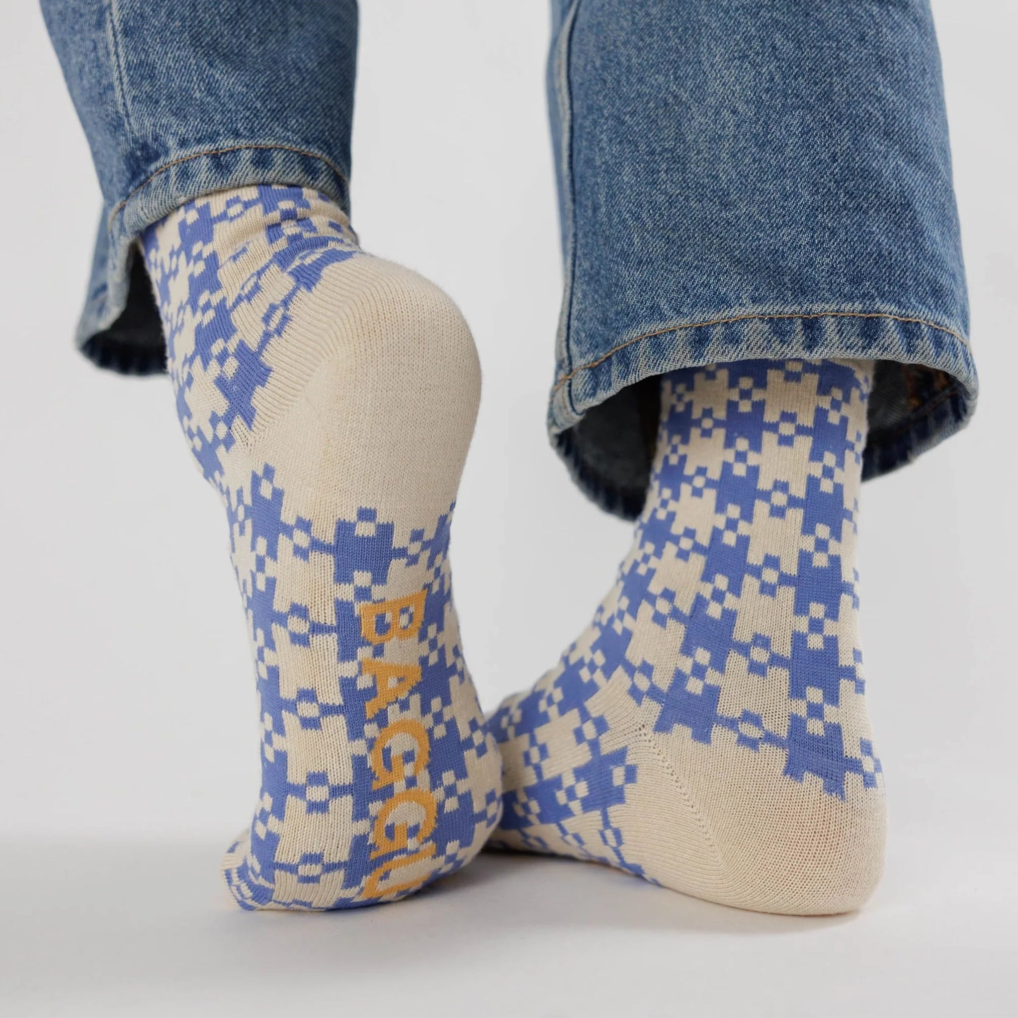 A pair of blue and ivory gingham printed crew socks