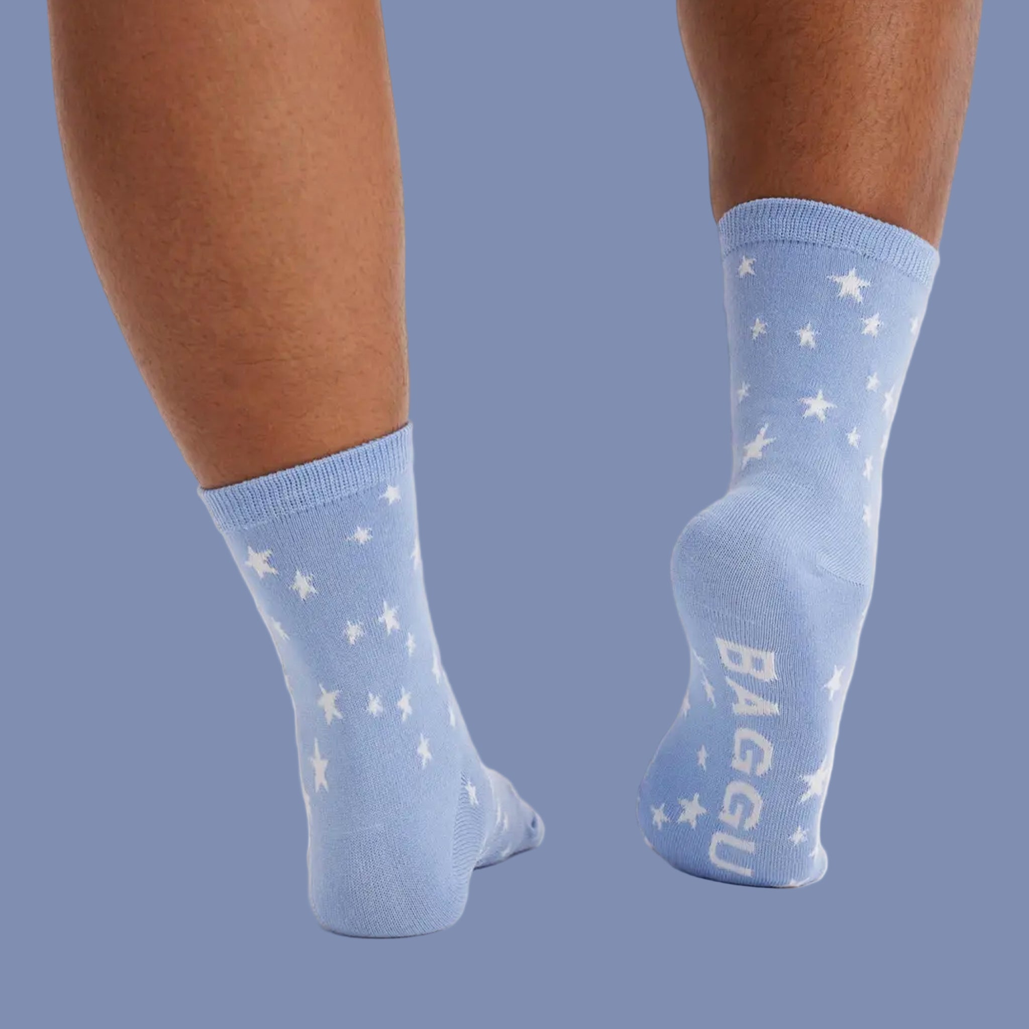 A light blue pair of socks with white stars.