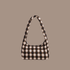 blurred brown gingham detailed nylon purse with zipper.