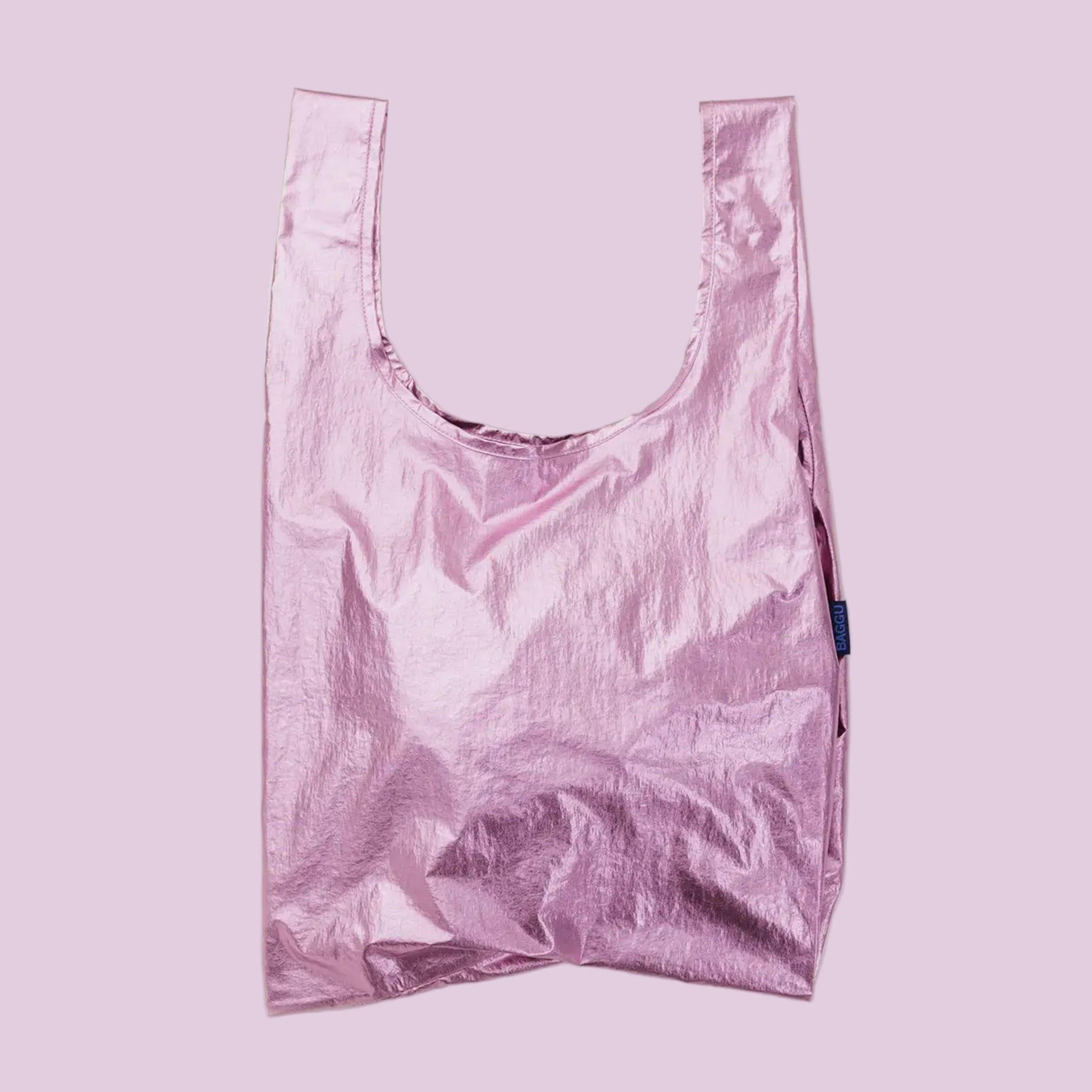 A light pink metallic nylon tote bag. 