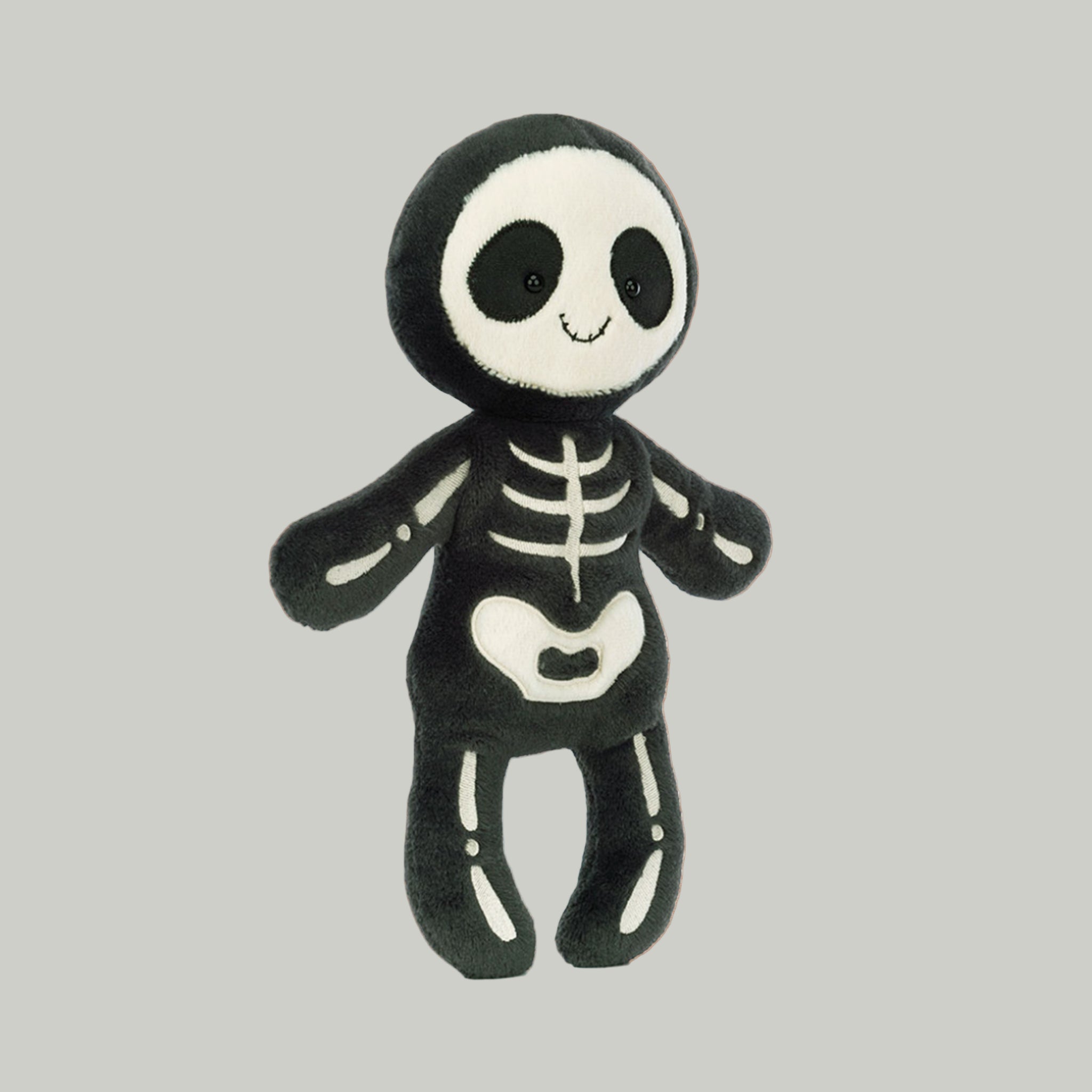 A black and white skeleton stuffed toy. 