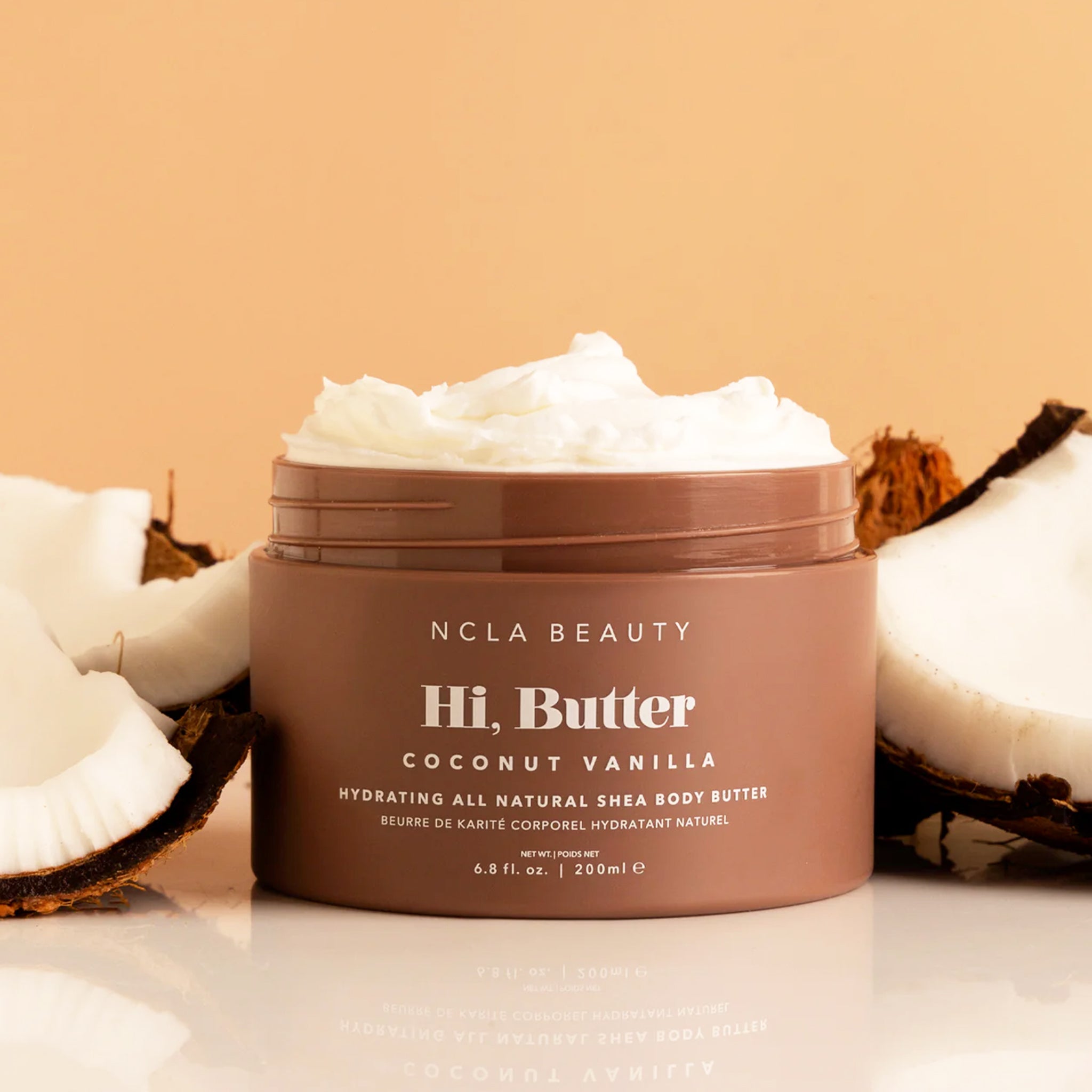 A brown jar of body butter in a coconut vanilla scent.