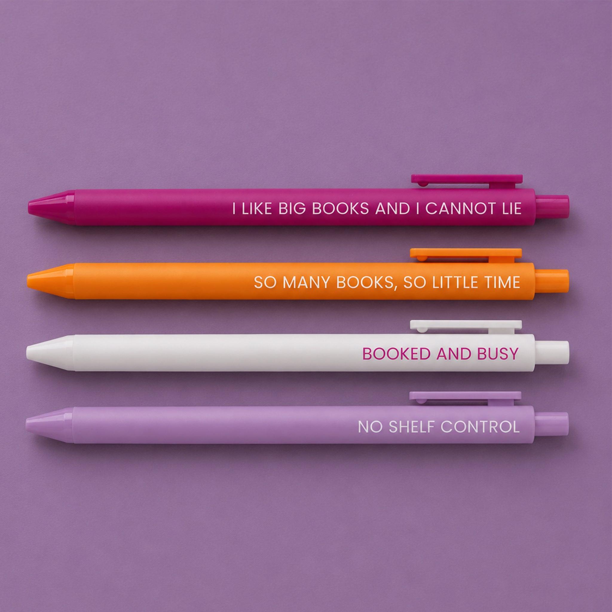 Set of four book related pens. 