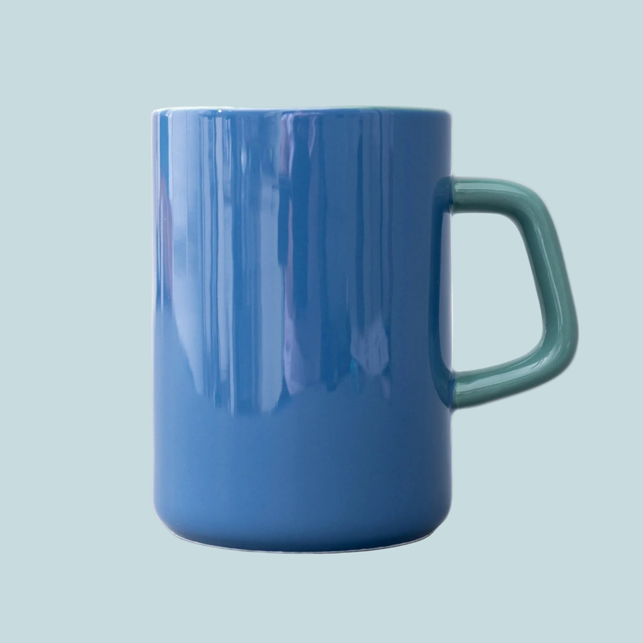 A blue and green mug with "Bookworm" on the front.