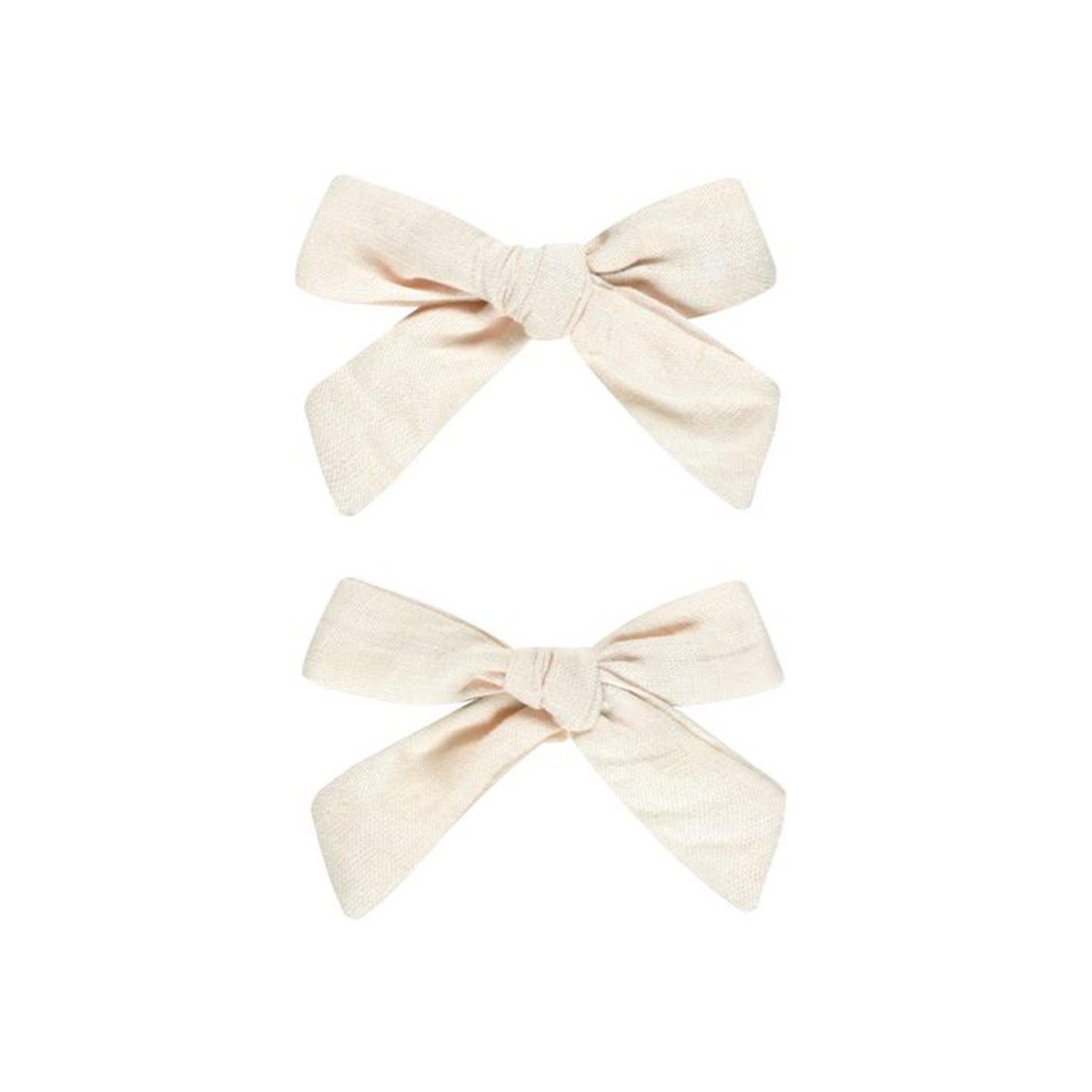 A set of two off white bow clips.