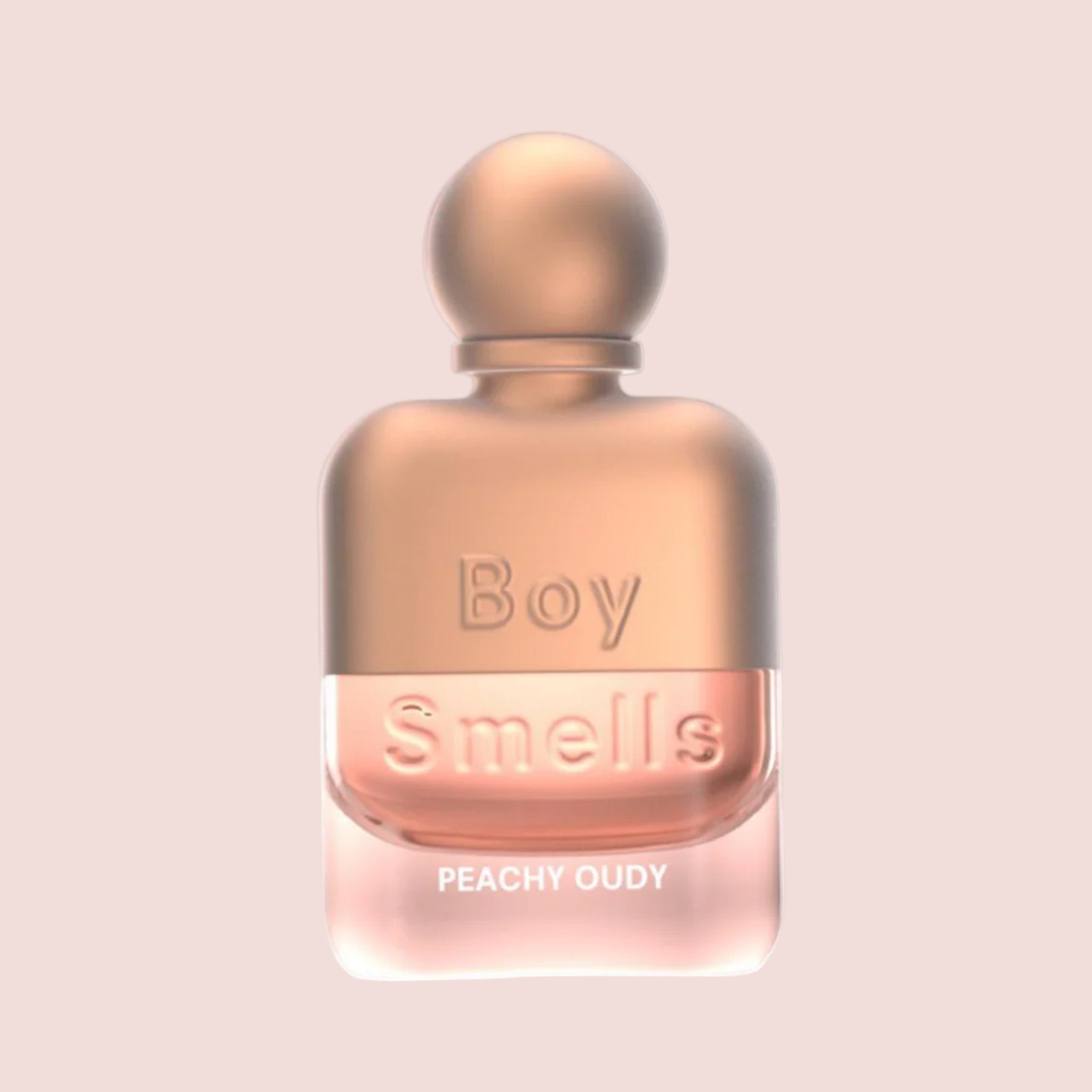 A bottle of perfume with a circular lid and text that reads, 'Boy Smells Peachy Oud'.