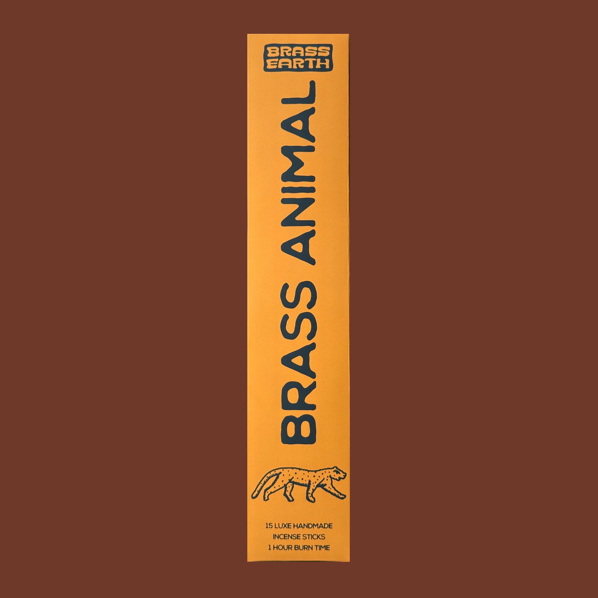 Brass Earth Brass Animal incense packaging on a brown background