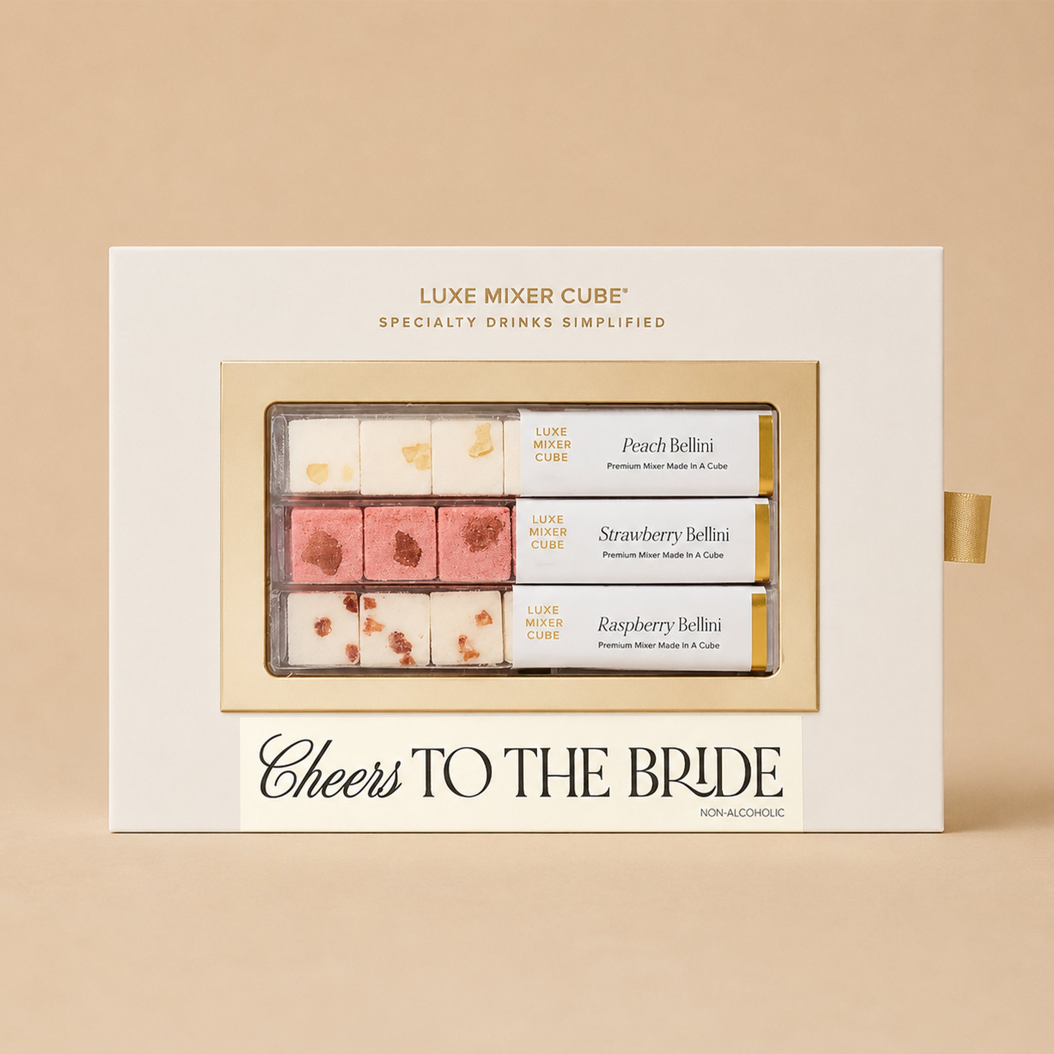 Gift box of Luxe Mixer Cube with 'Cheers to the Bride' text on a beige background