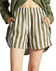 On a white background is a pair of white and olive green shorts with an elastic waistband and pockets. 