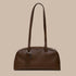 A chocolate brown recycled leather handbag with shoulder straps. 