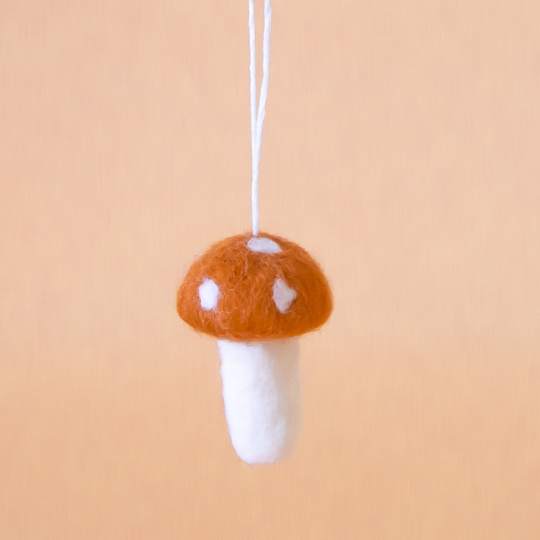 {"media":[{"id":"gid://shopify/MediaImage/24231669071923","alt":"Brown felt mushroom ornament with white spots on the mushroom cap, and a white stem are shown against a peach colored background. ","type":"IMAGE","src":"https://cdn.shopify.com/s/files/1/0350/5665/files/felt-mushroom-brown_24x24@3x.jpg?v=1727893242","altText":"Brown felt mushroom ornament with white spots on the mushroom cap, and a white stem are shown against a peach colored background. "}],"mediaCount":1}