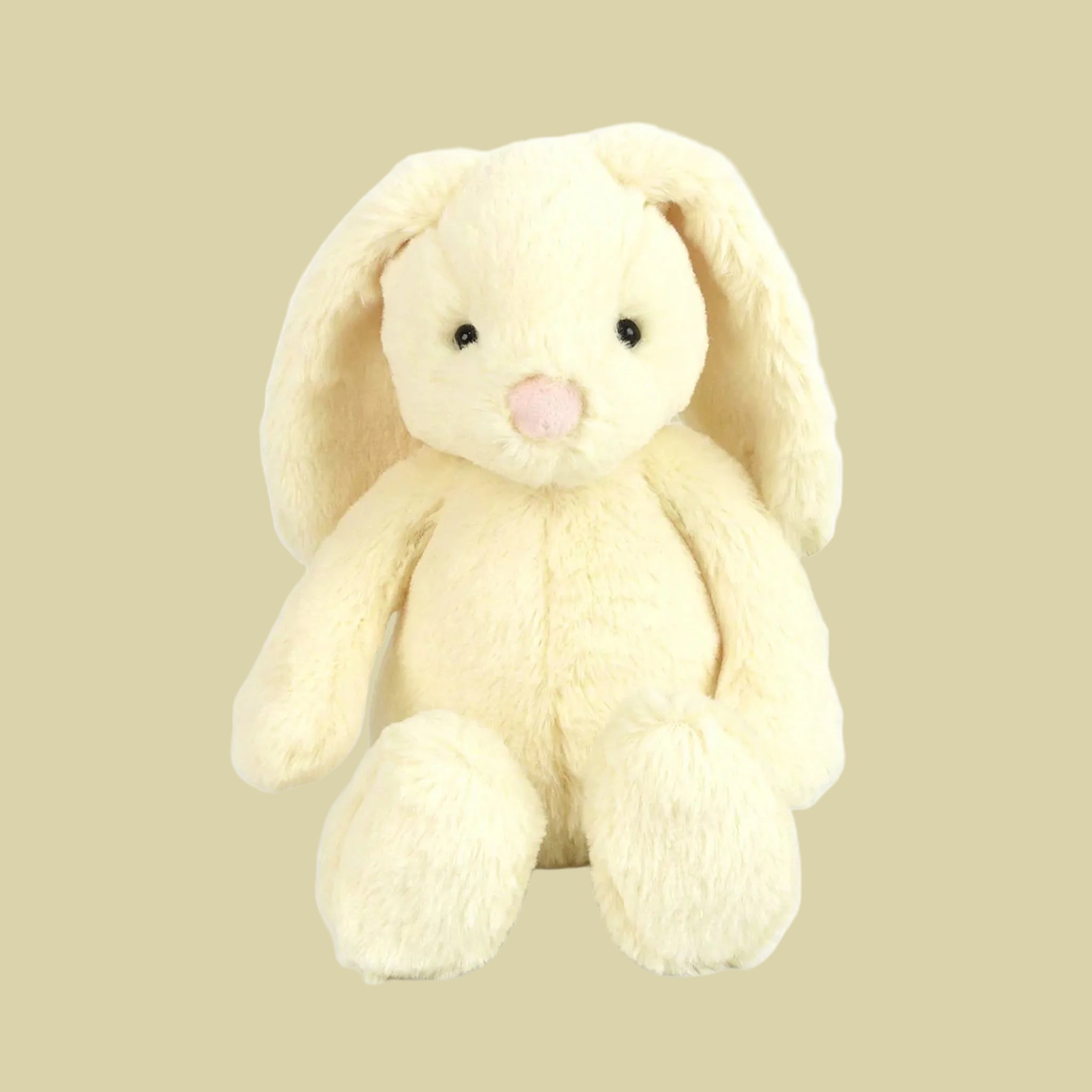 A butter yellow bunny stuffed animal. 