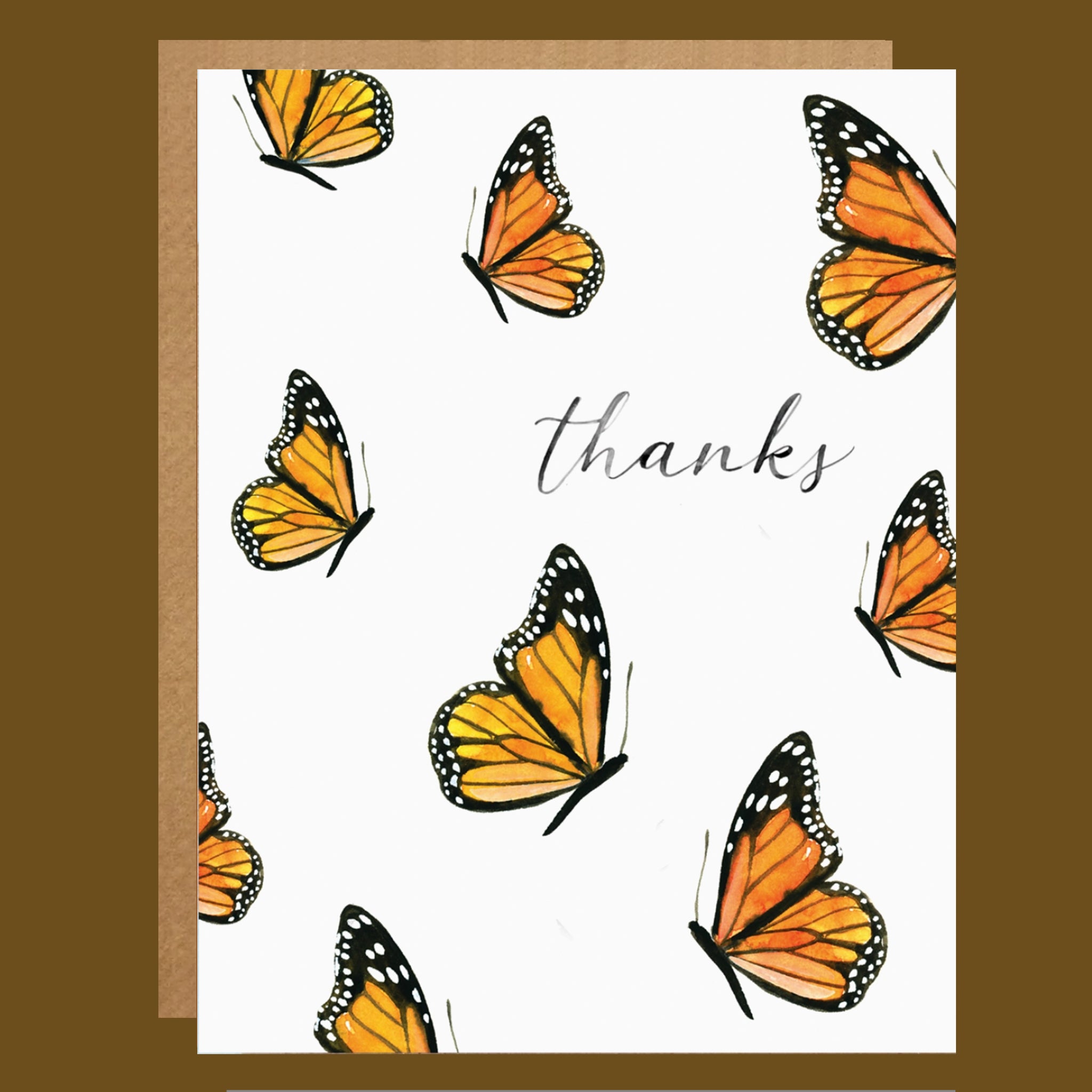 Greeting card with orange and black butterflies and the word 'thanks' on a white background.