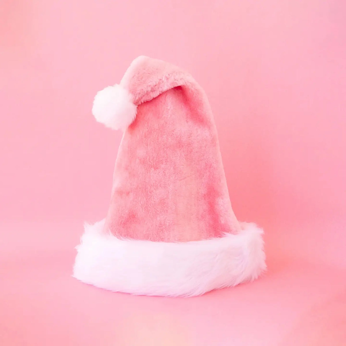pink santa hat with white faux fur detailing.