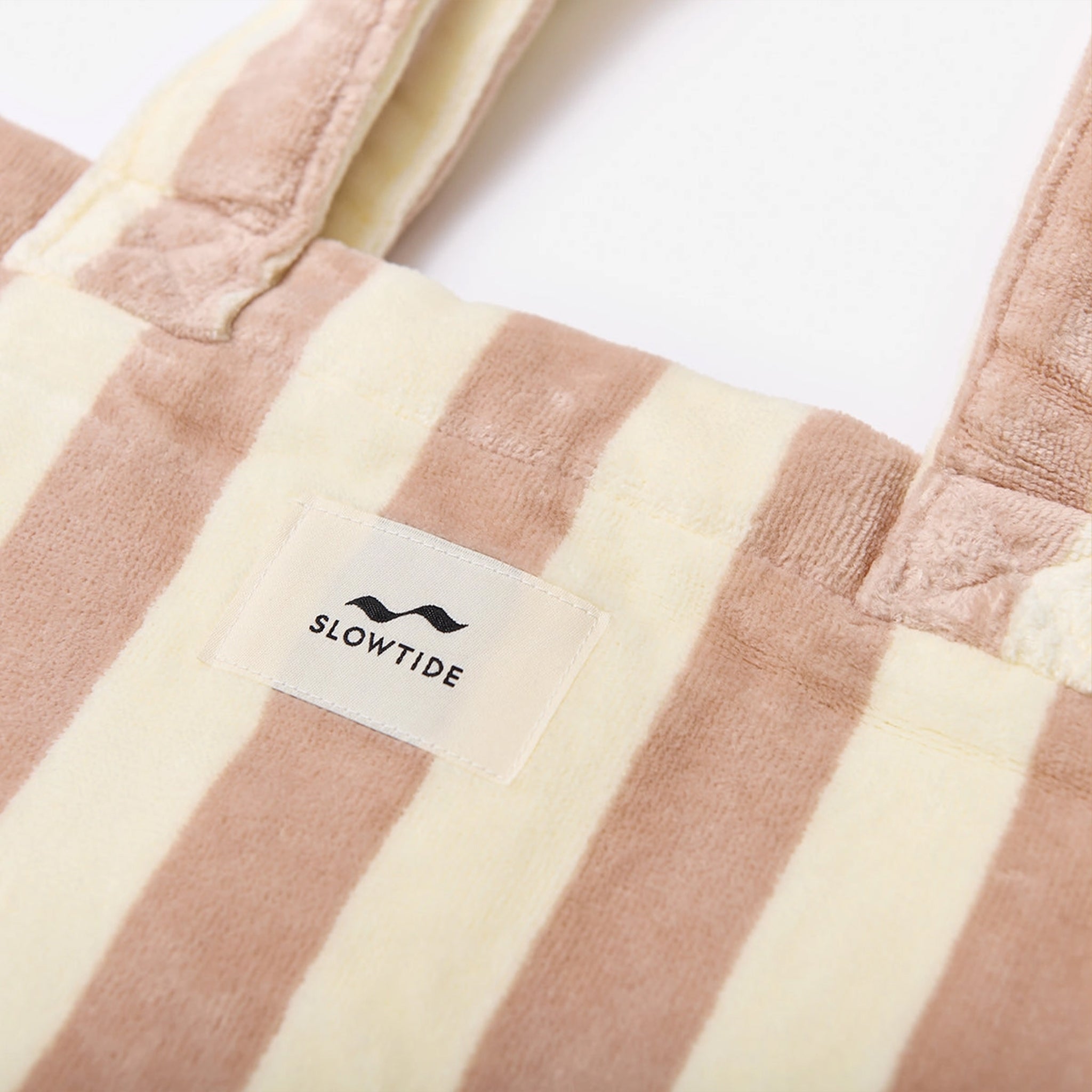 A pink and cream striped terry cotton tote bag. 