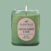 A light green glass candle with a ivory label that reads,'Paddywax Nashville, Tennessee Cactus Flower & Aloe Soy Wax Candle.'