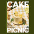 Book cover of 'Picnic Cake' with a cake on a table and flowers, featuring the author's name.