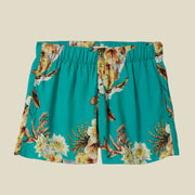 A teal tropical floral print pair of shorts. 
