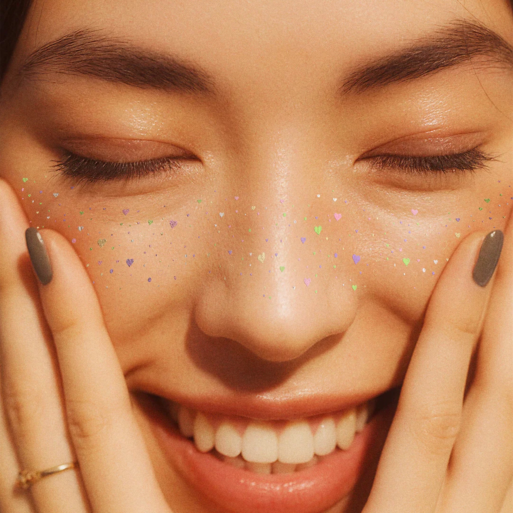 A set of sparkle heart shaped freckle makeup patches. 