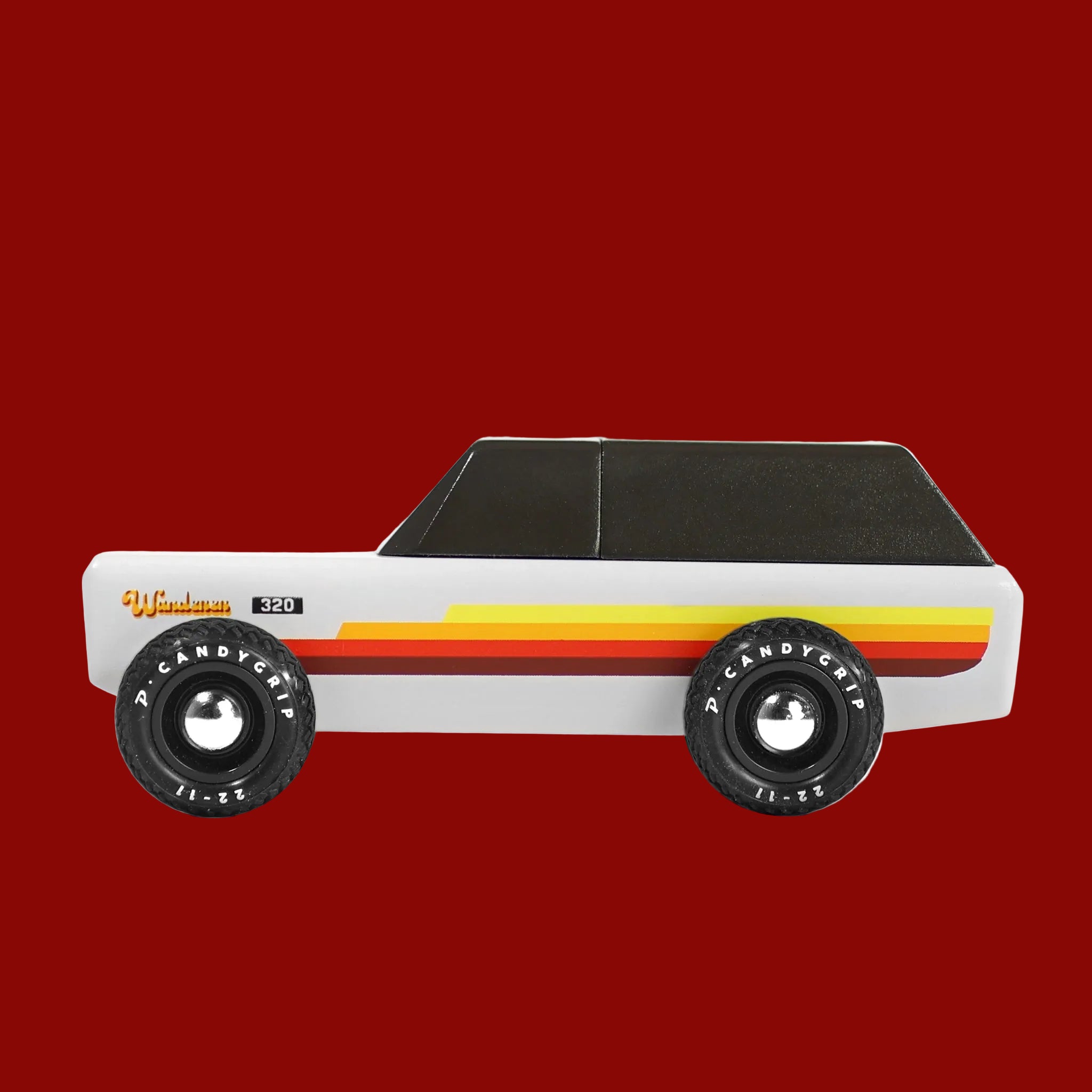 A white wooden car shaped toy. 