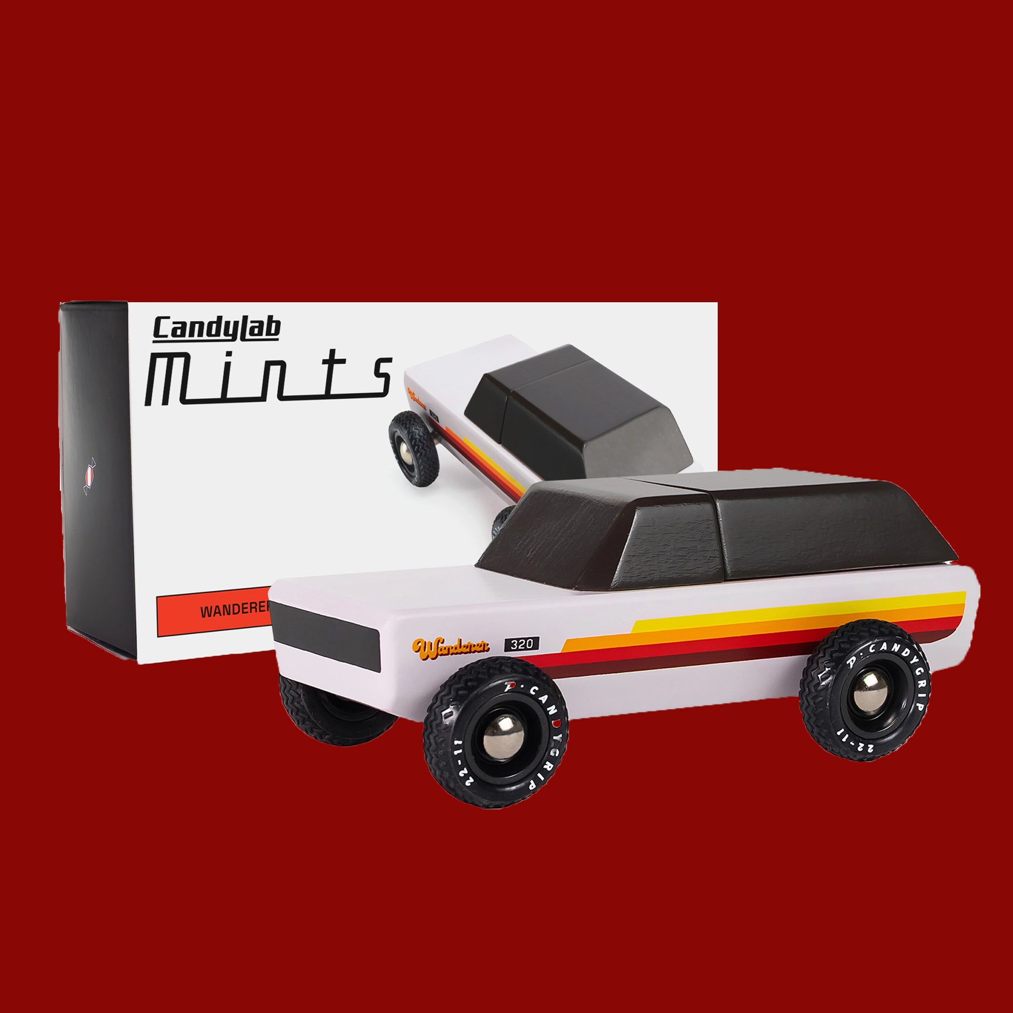 A white wooden car shaped toy. 