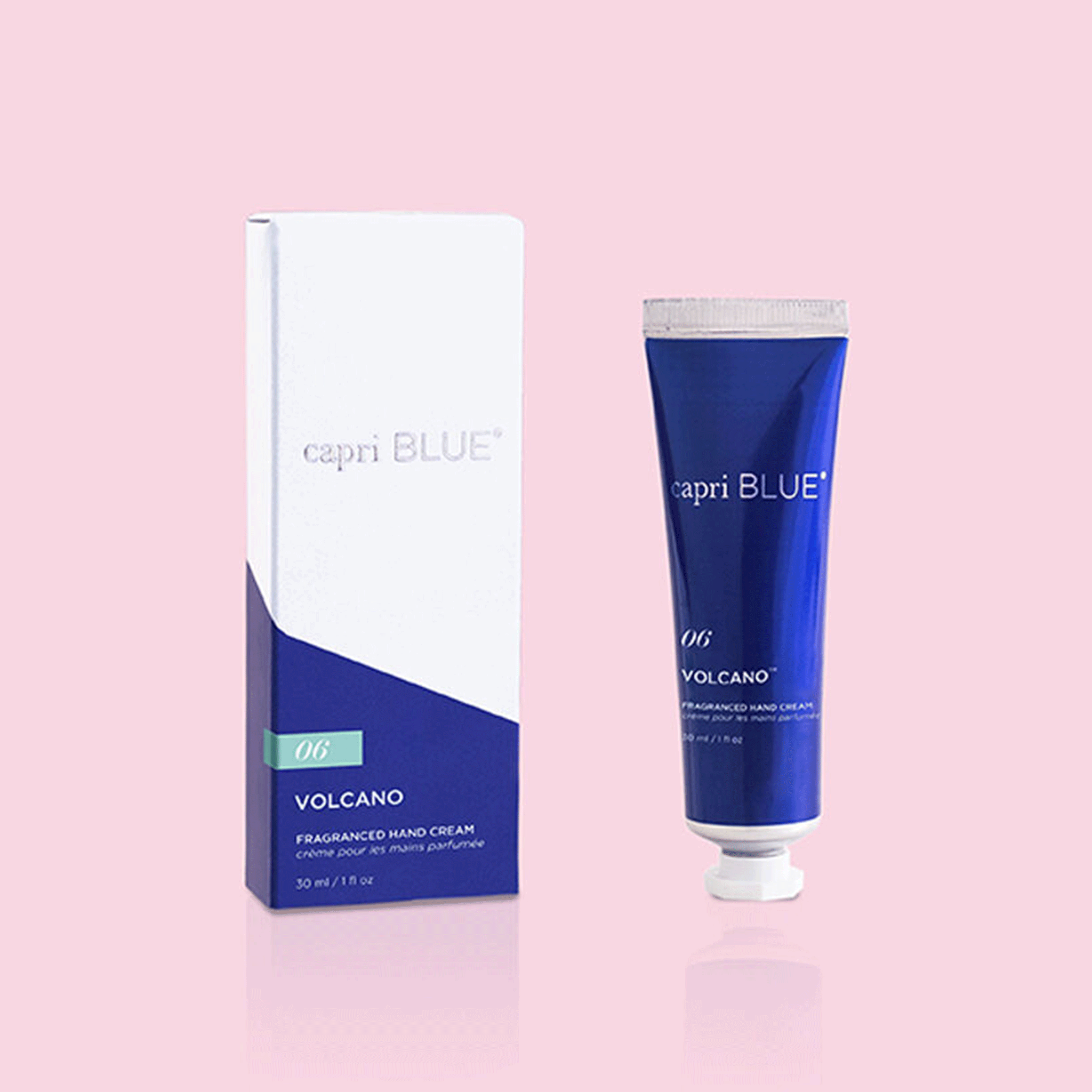 On a pink background is a blue bottle of hand cream with silver text that reads, "capri BLUE 06 Volcano".