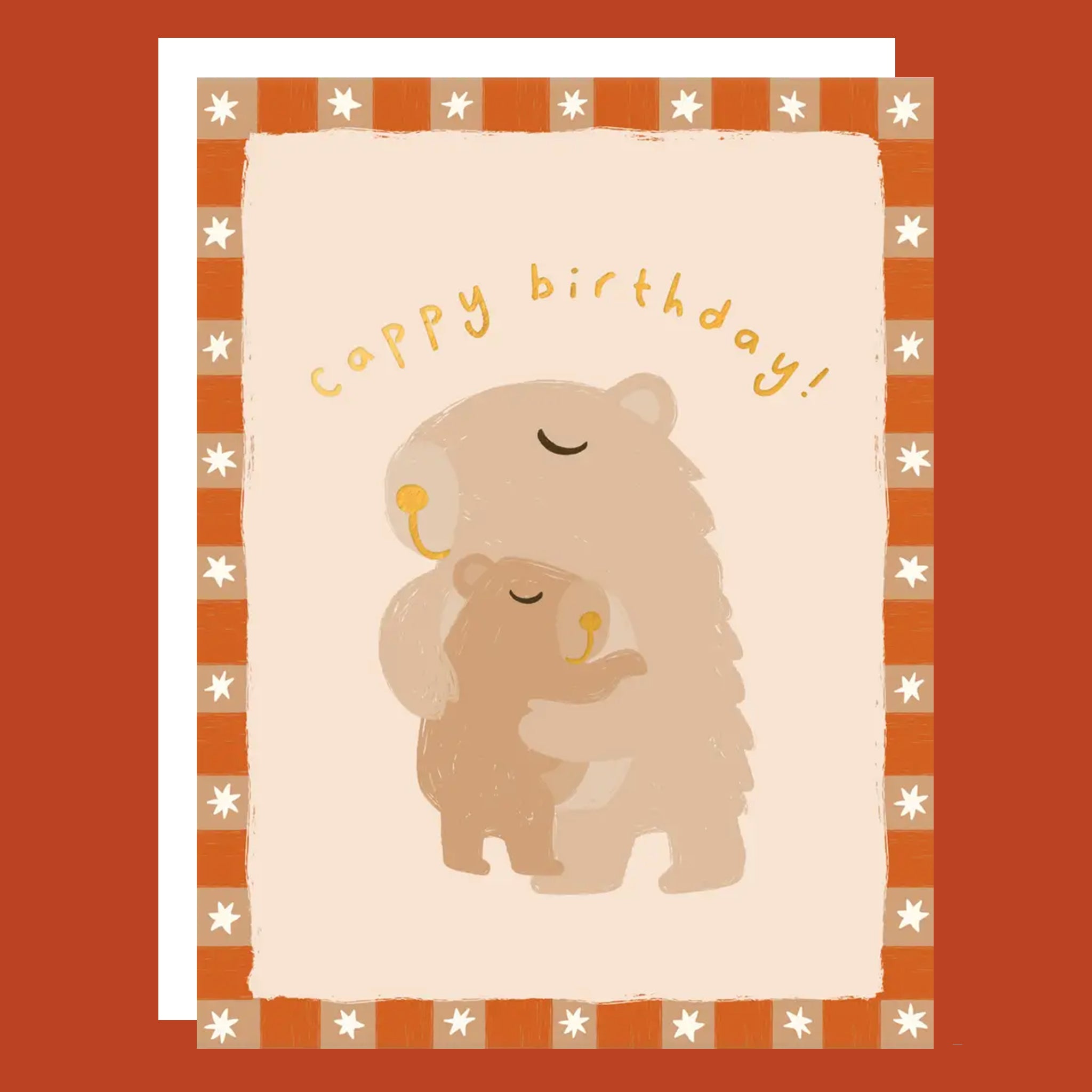 Orange greeting card with a Mama Capybara hugging a Baby Capybara. The card reads "Cappy Birthday".