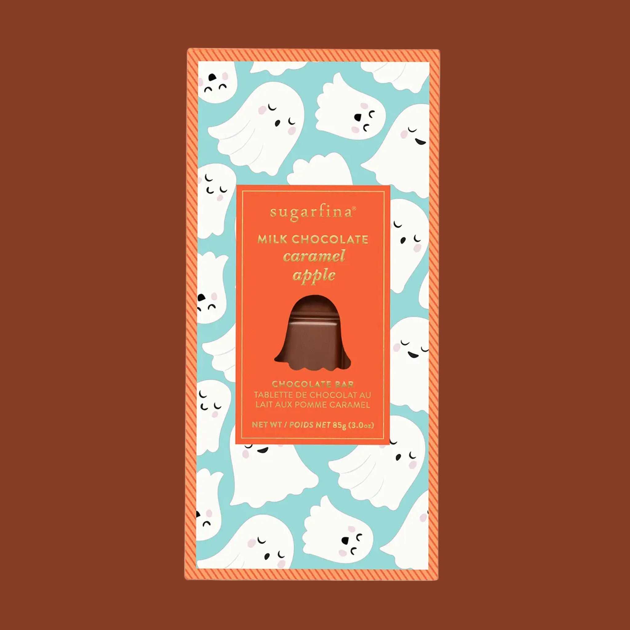 A caramel apple shaped chocolate bar with a ghost graphic packaging. 
