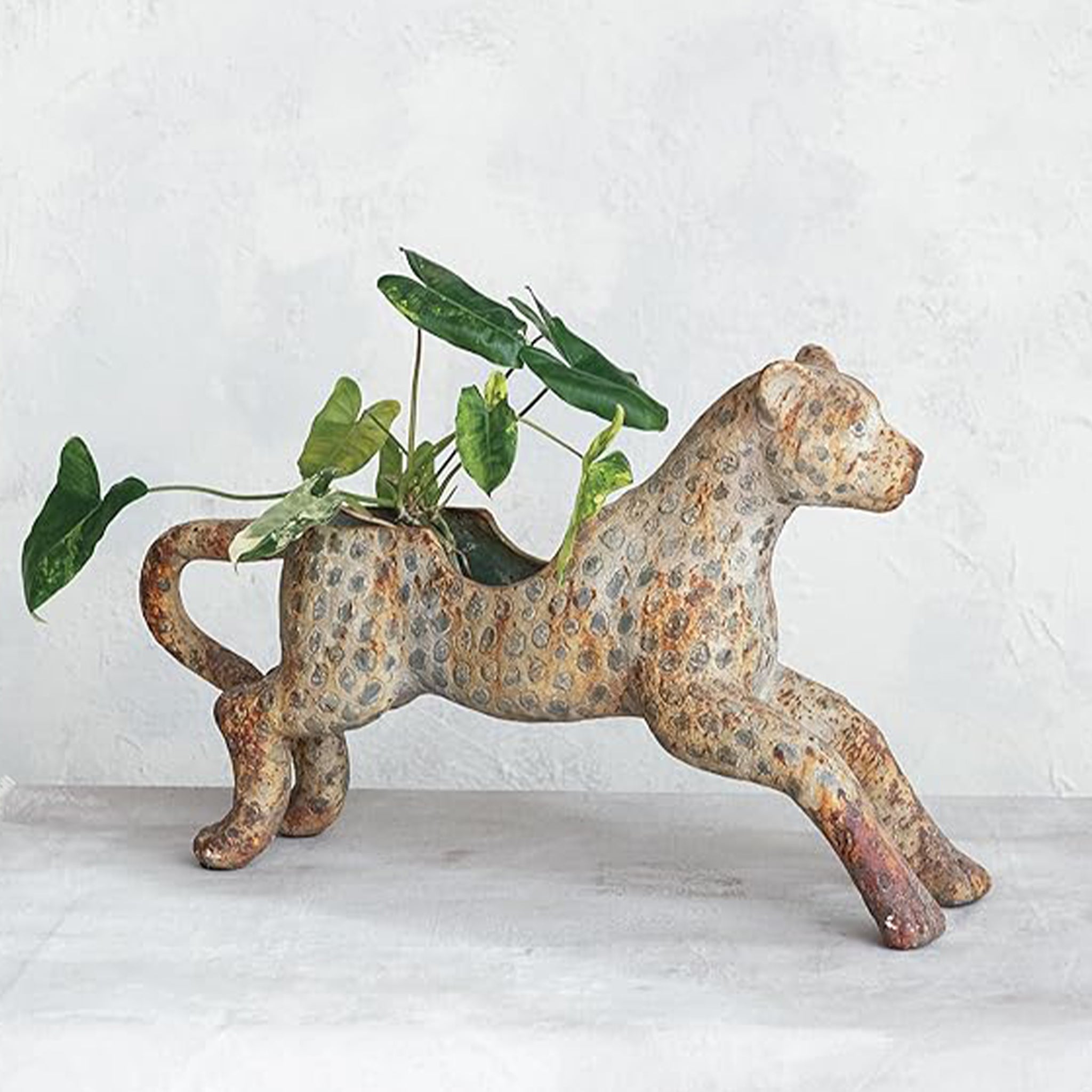 A leopard shaped rustic planter. 