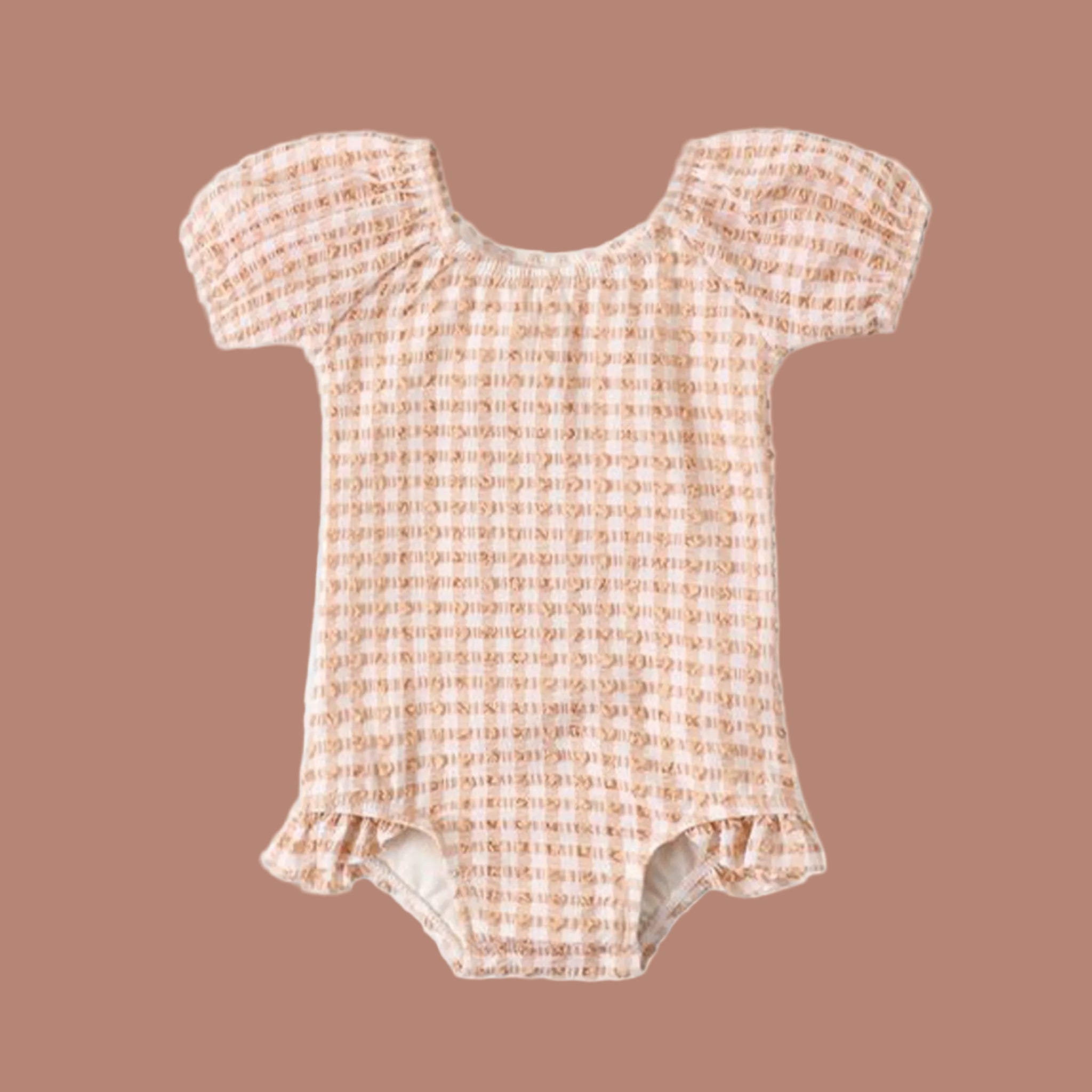 A peach and cream checkered puff sleeve one piece swim suit for babies and toddlers. 