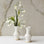 An ivory ceramic budvase. 