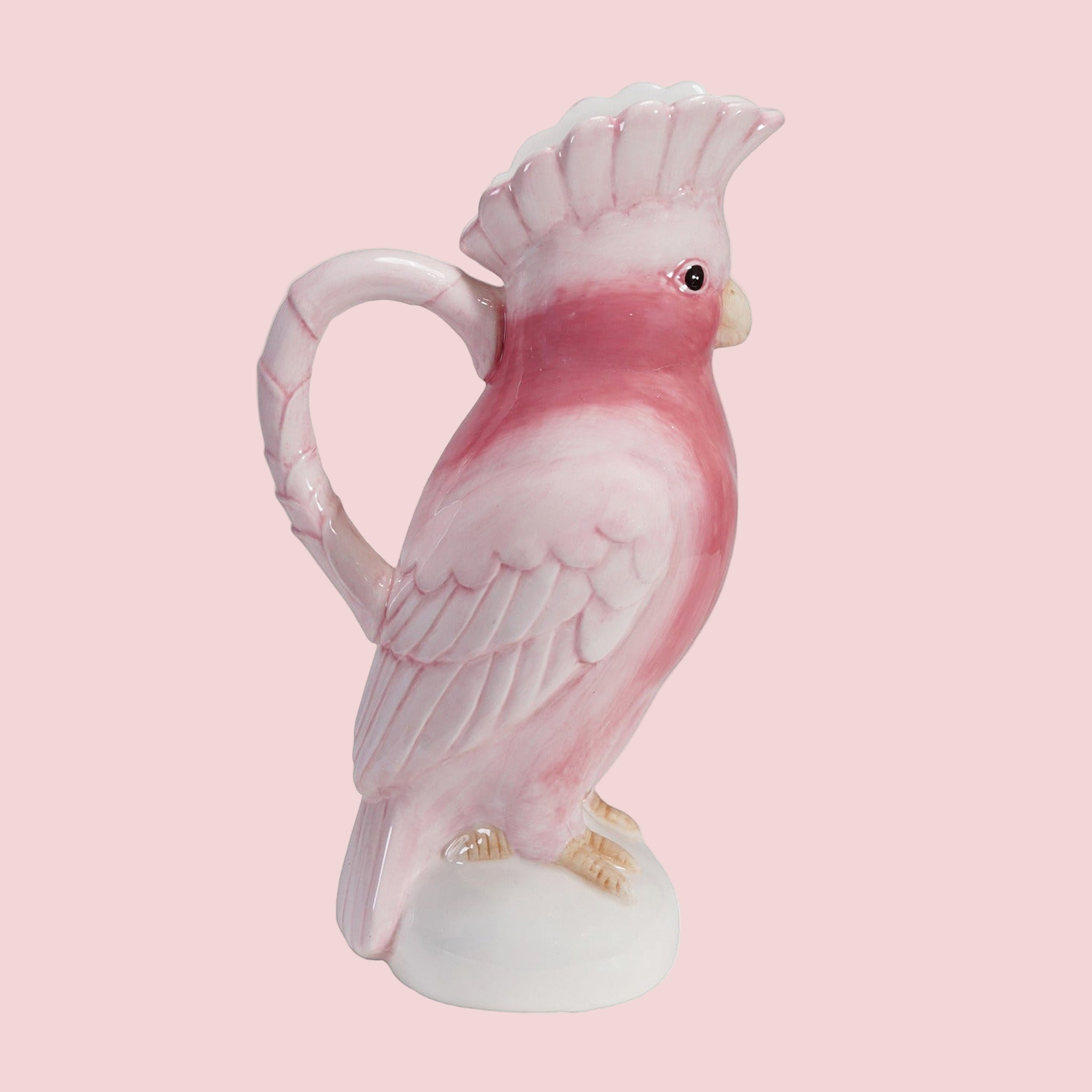 A pink cockatoo ceramic pitcher. 