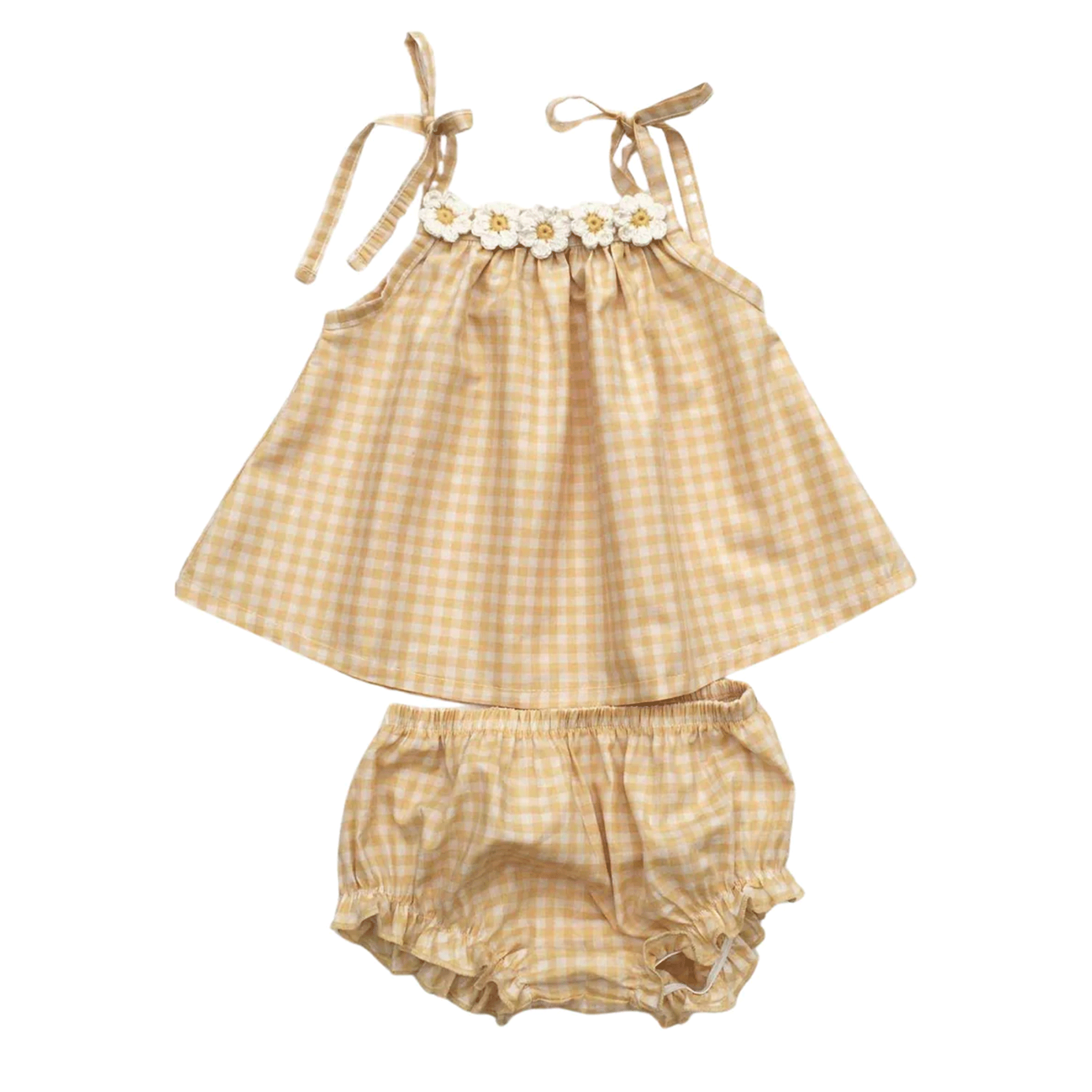 On a white background is a tan gingham set with bloomers and a flowy top with tie details and a daisy neckline. 