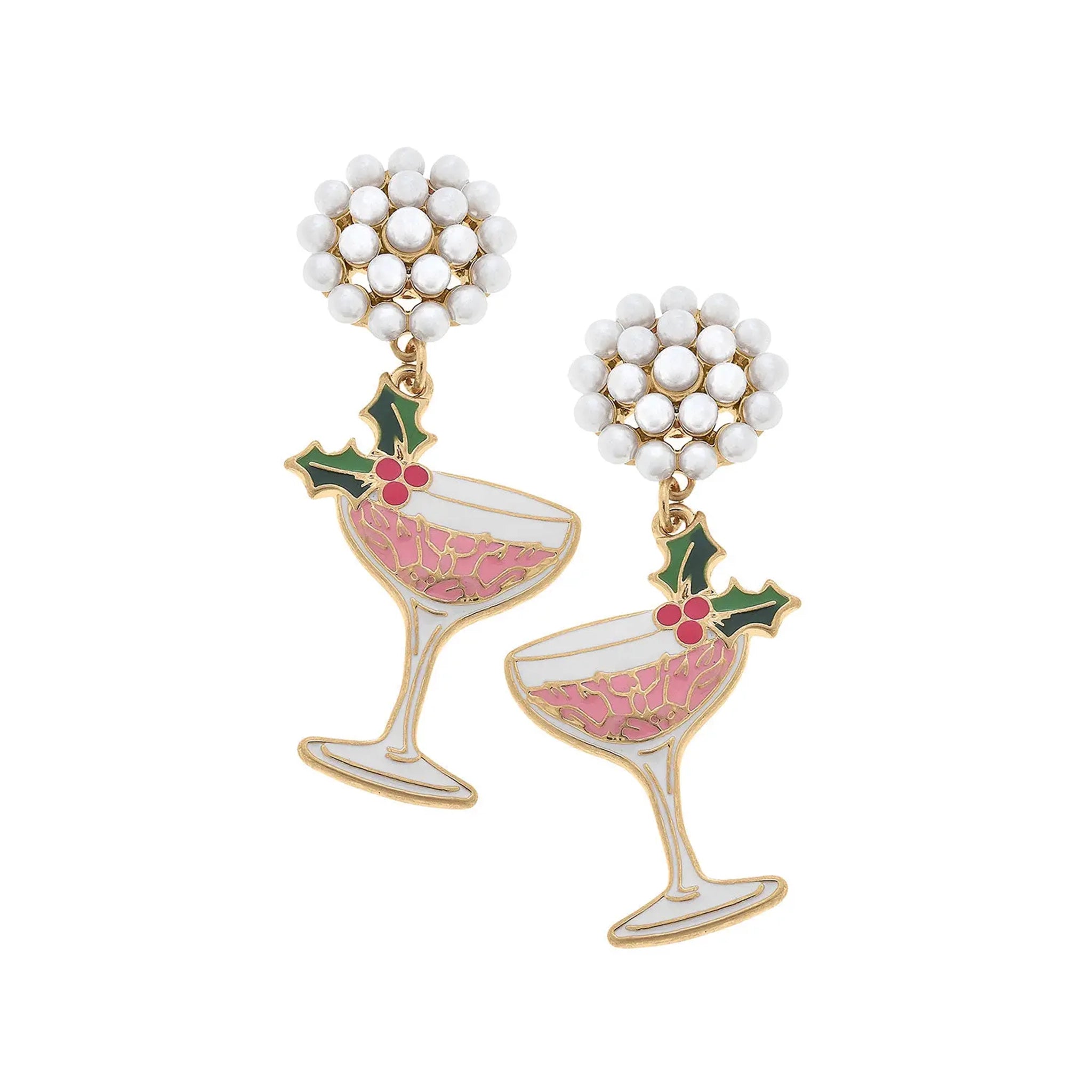 On a white background is a pair of dangling earrings in the shade of a coupe glass with a pink beverage and a holly garnish. 