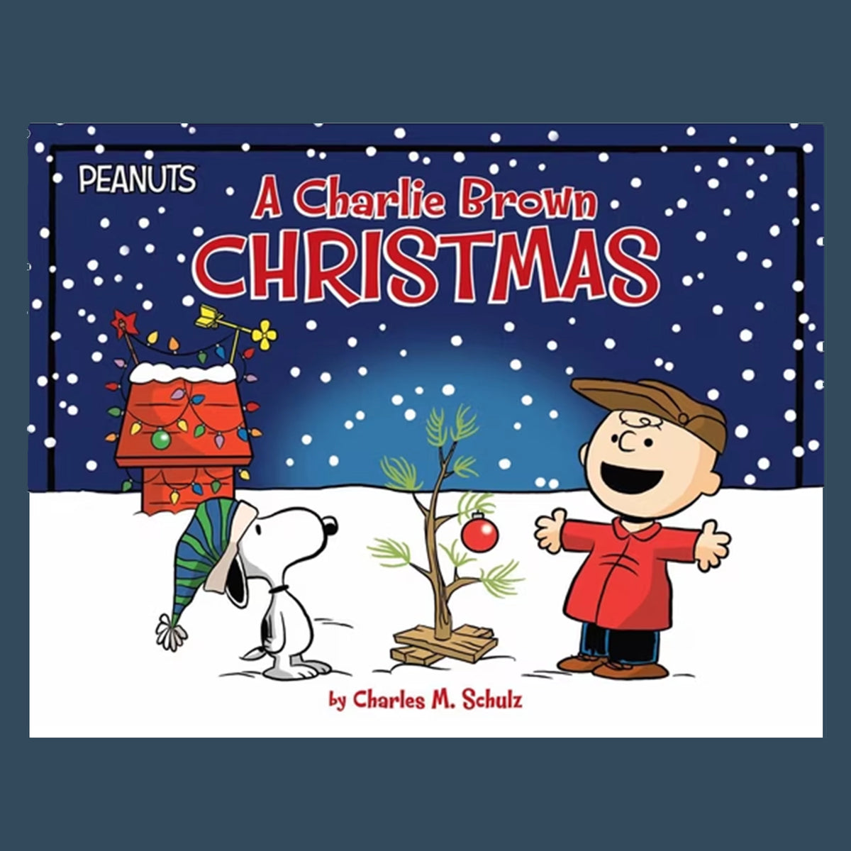 Book cover for 'A Charlie Brown Christmas' by Charles M. Schulz, featuring Peanuts characters Snoopy, Charlie Brown, and Woodstock in a snowy night scene with a decorated tree and red title text.