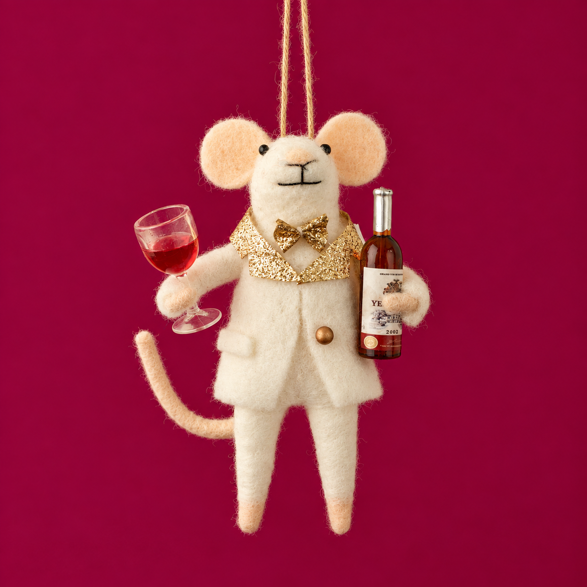 A felt mouse ornament holding wine. 