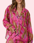 A hot pink and cheetah print button up long sleeve pajama top. 