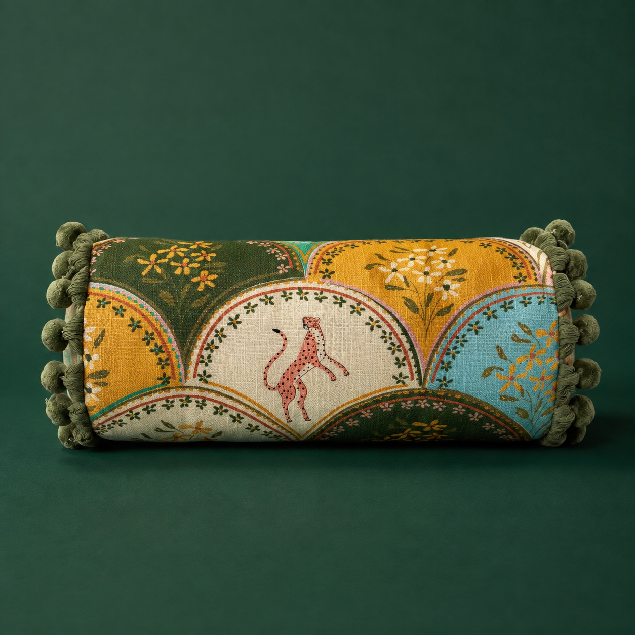A floral and cheetah patterned bolster pillow. 