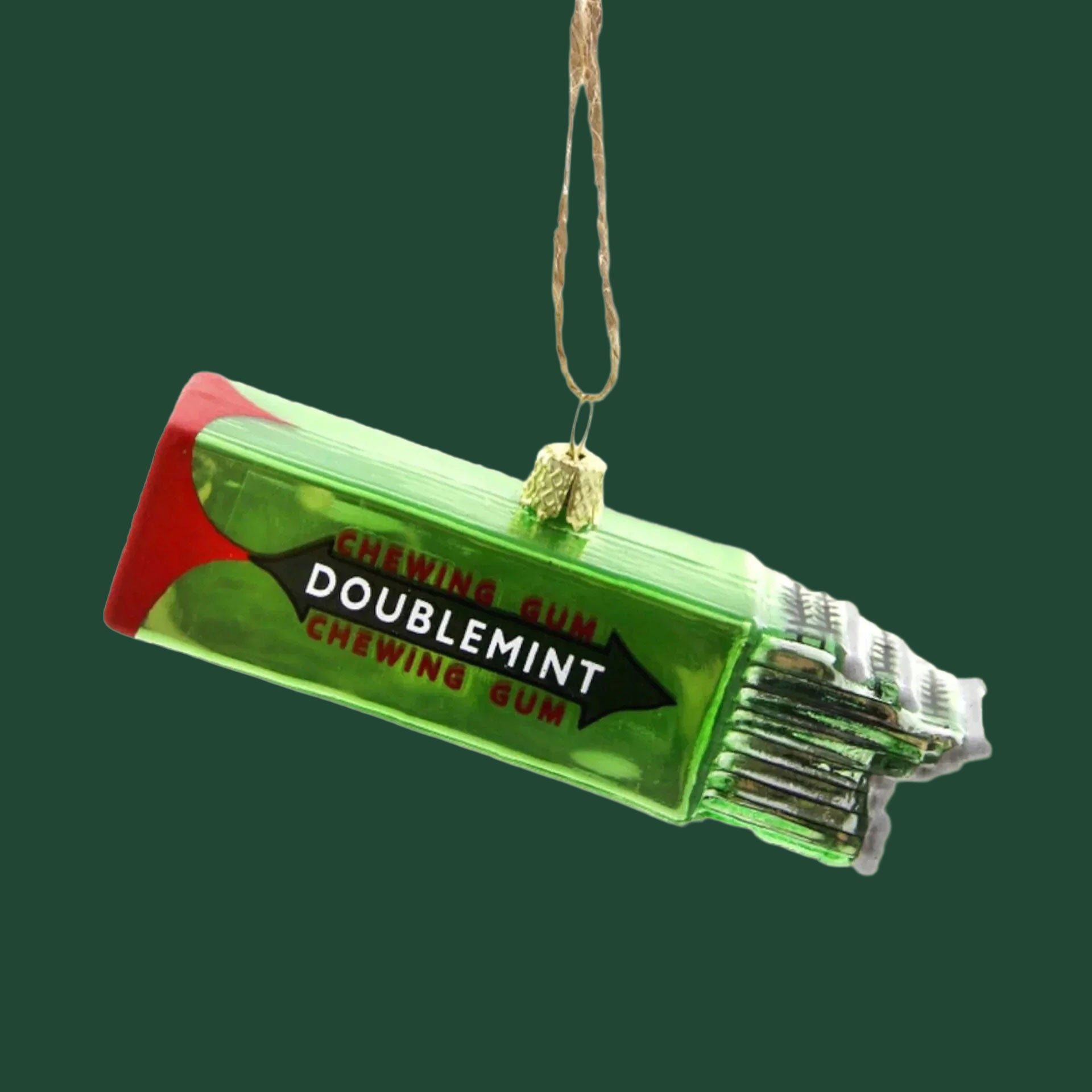 A green ornament in the shape of a pack of chewing gum with text on the front that reads, 'Chewing Gum Doublemint Chewing Gum'. 