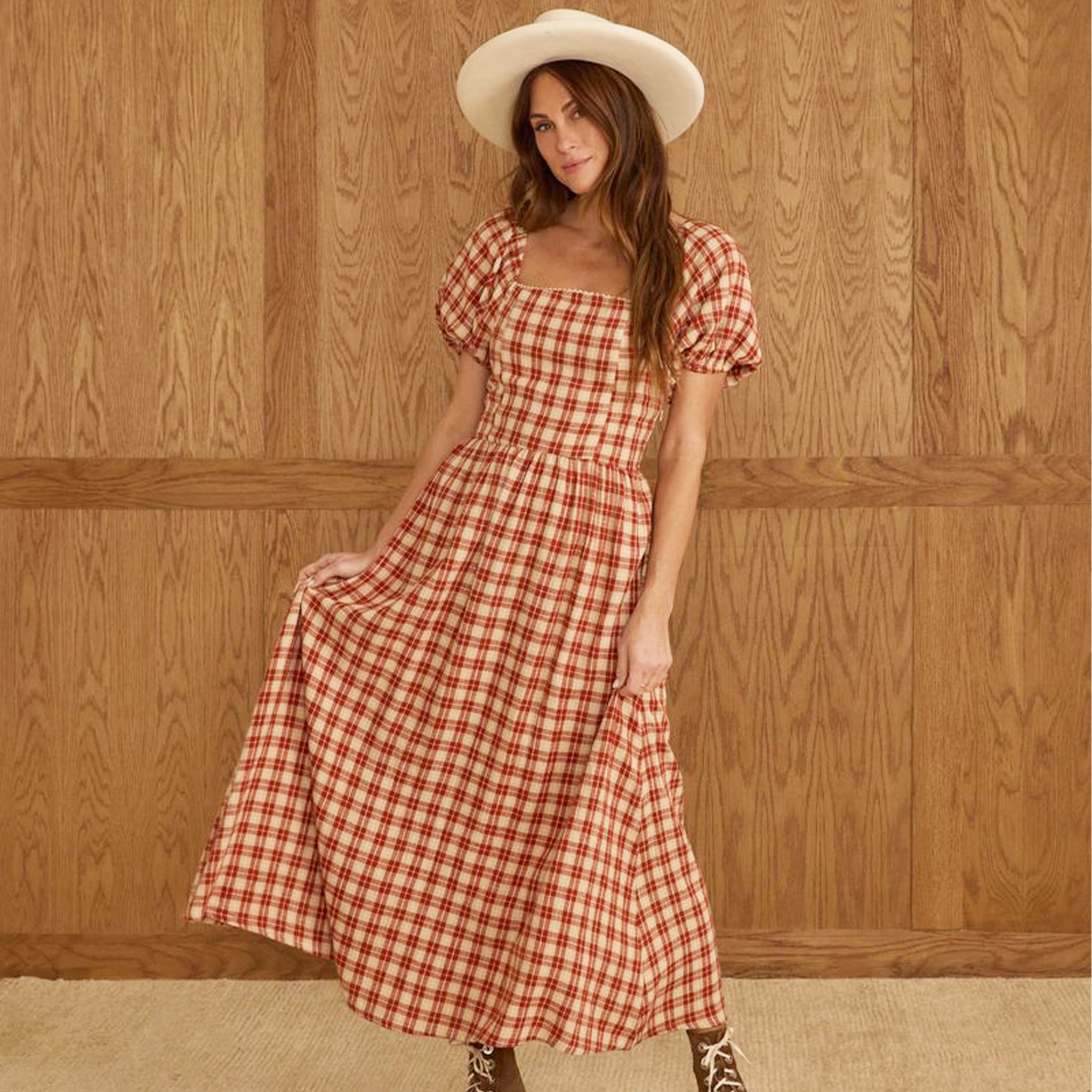 A red and ivory plaid dress with puff sleeves and a square neckline. 